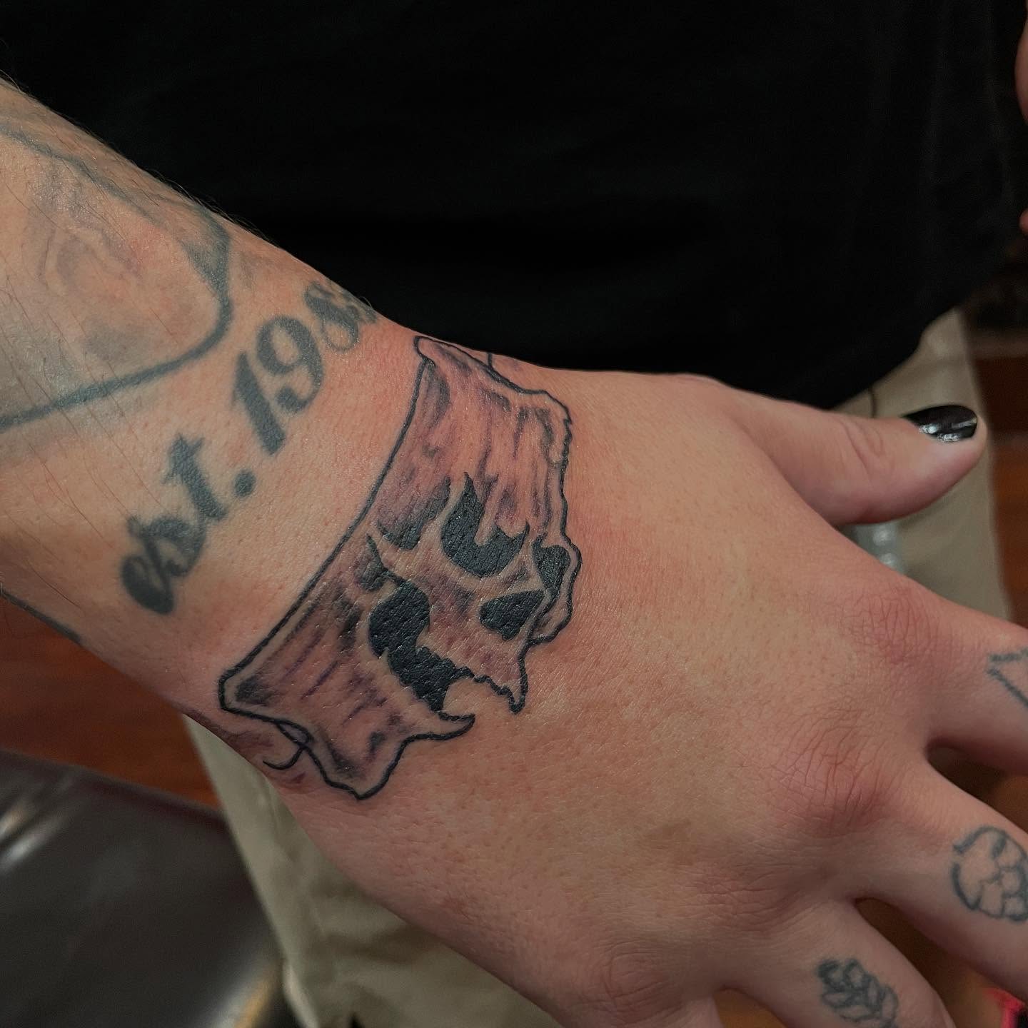 Skull black and grey tattoo on the forearm by Chrissy Ungrew Tattoos, Covington, Kentucky