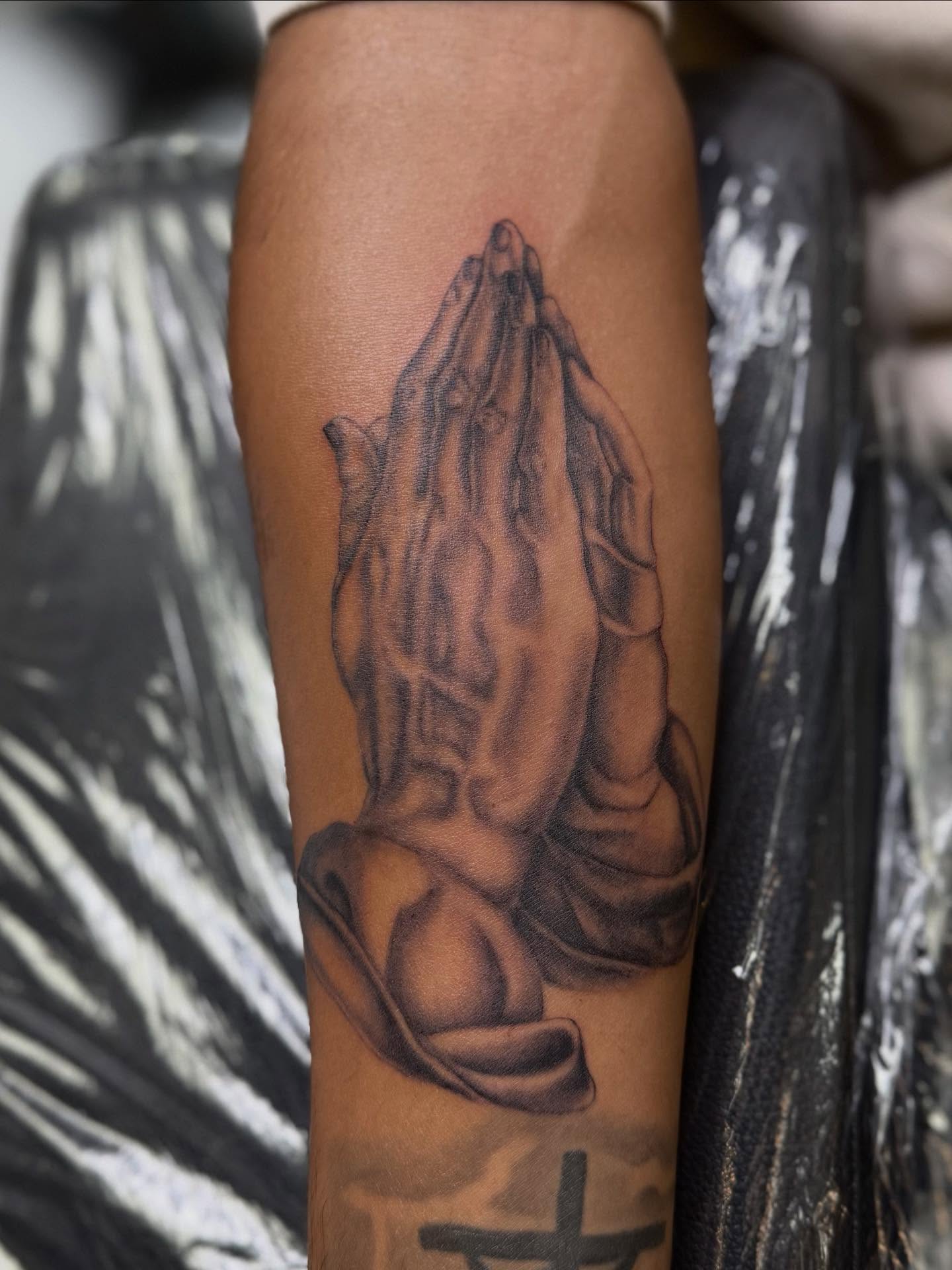 Praying hands realism tattoo on the forearm by ♍️𝒾𝒸𝒽𝑒𝓁𝓁𝑒⁺‧₊˚ ཐི⋆♱⋆ཋྀ ˚₊‧⁺, Charlotte, North Carolina