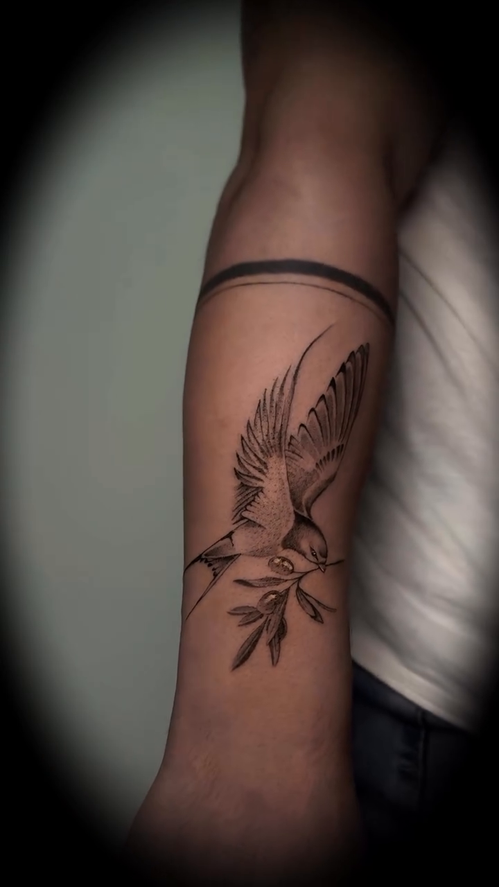 Bird with branch fine line tattoo on the forearm by Nyc Tattoo Manhattan