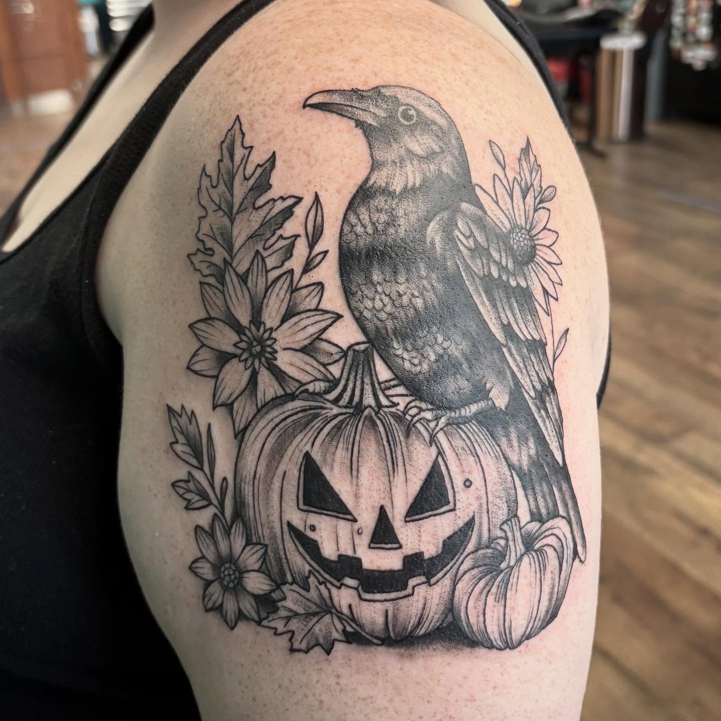Crow and pumpkin realism tattoo on the shoulder by Robbie Reel, Wichita, Kansas