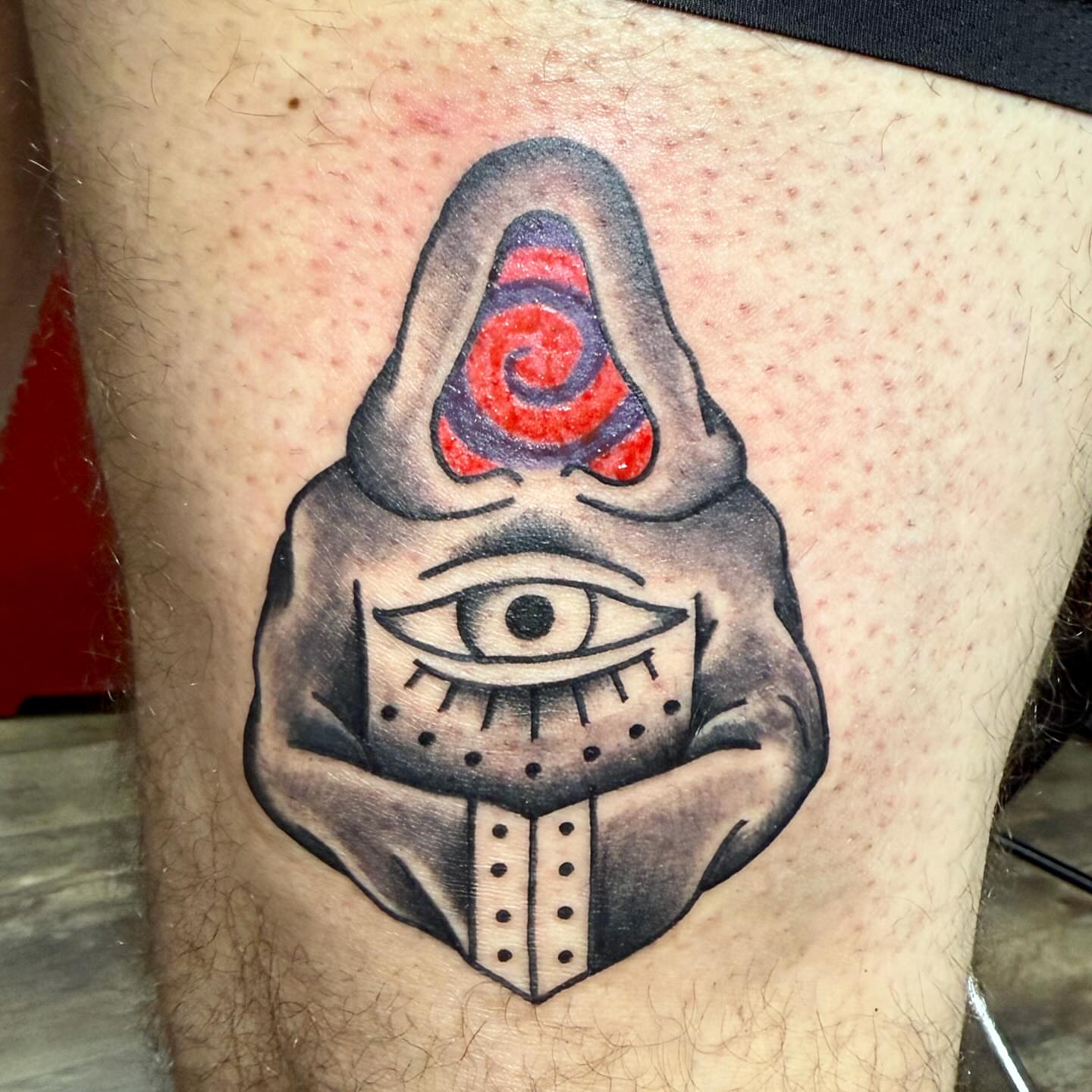 Eye with spiral dotwork tattoo on the thigh by Hunter Beyer