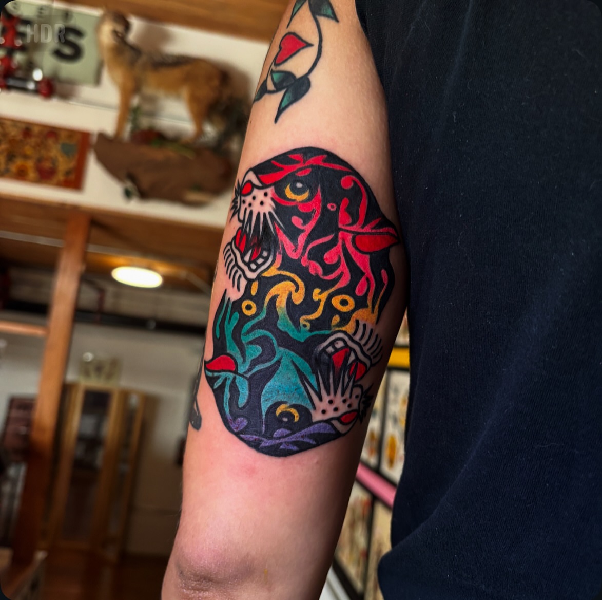 Jaguar American traditional tattoo on the forearm by Nick