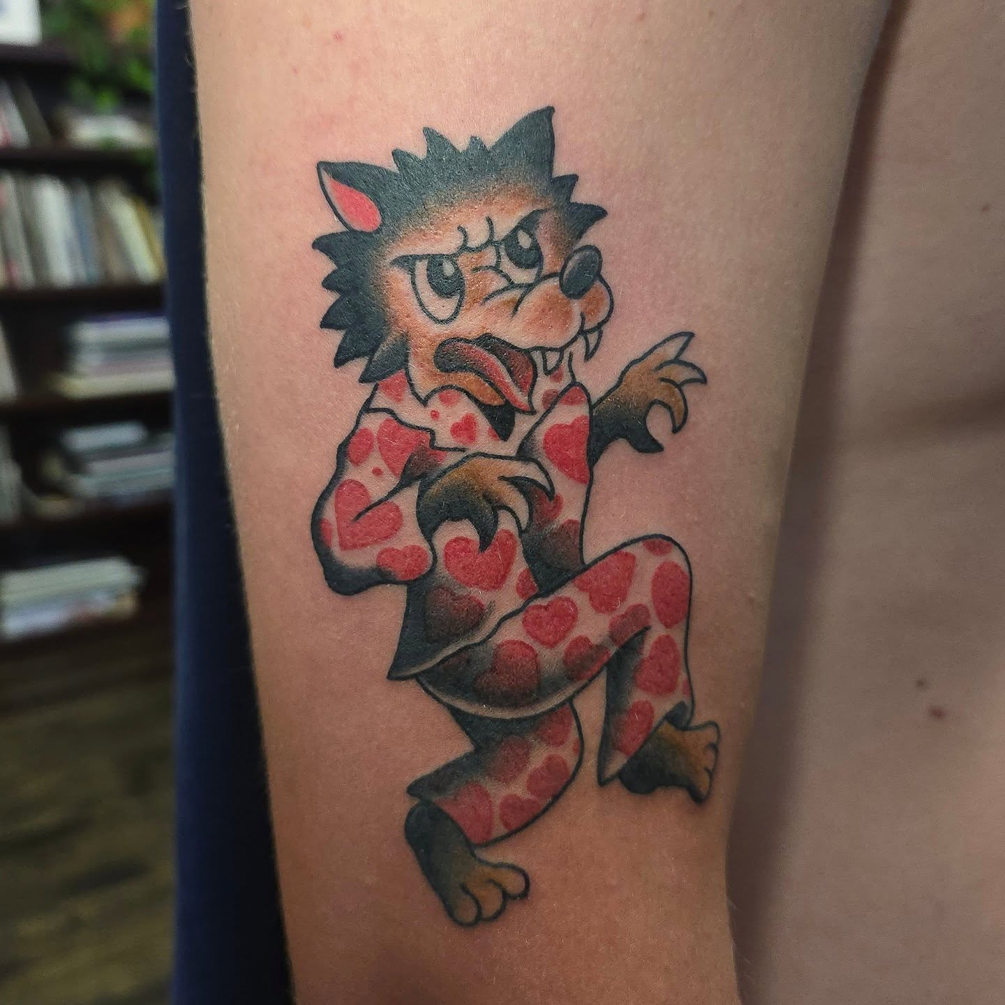 Angry werewolf American traditional tattoo on the forearm by Joseph Jeffers