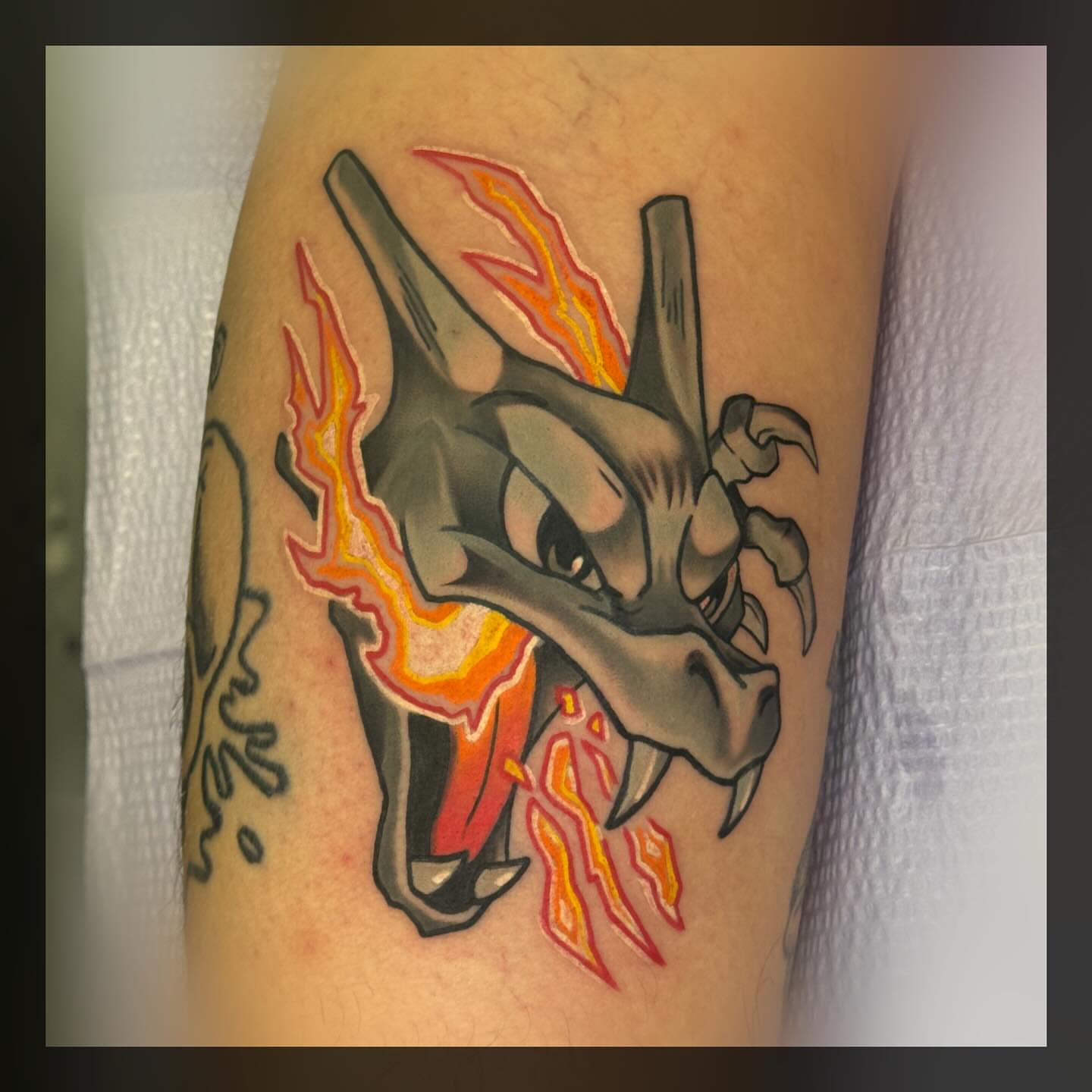 Dragon American traditional tattoo on the forearm by Romans