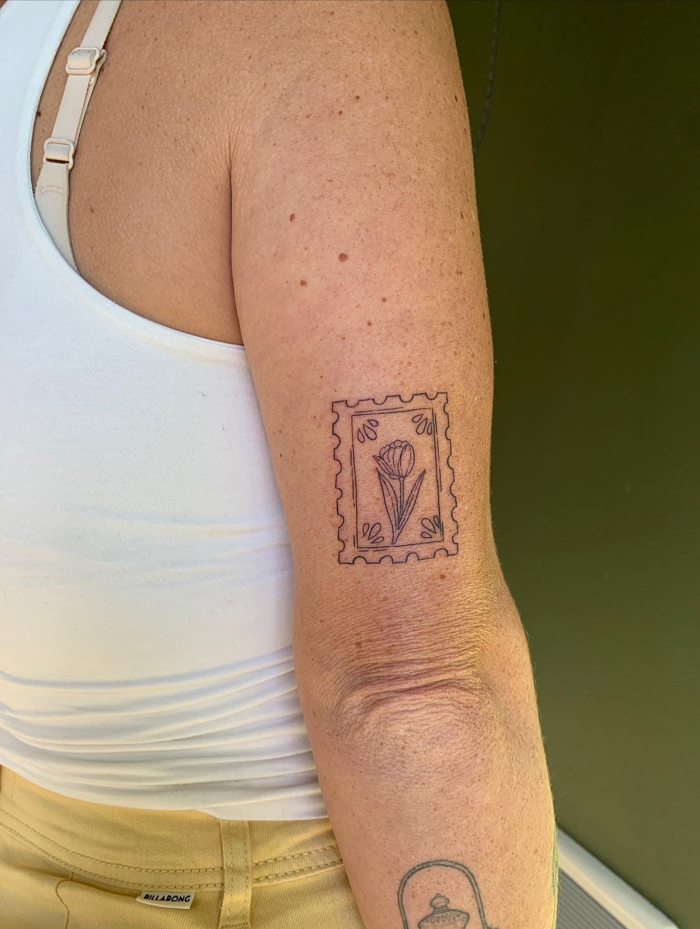 Postage stamp black and grey tattoo on the forearm by ⊹ Avery Peterson ⊹