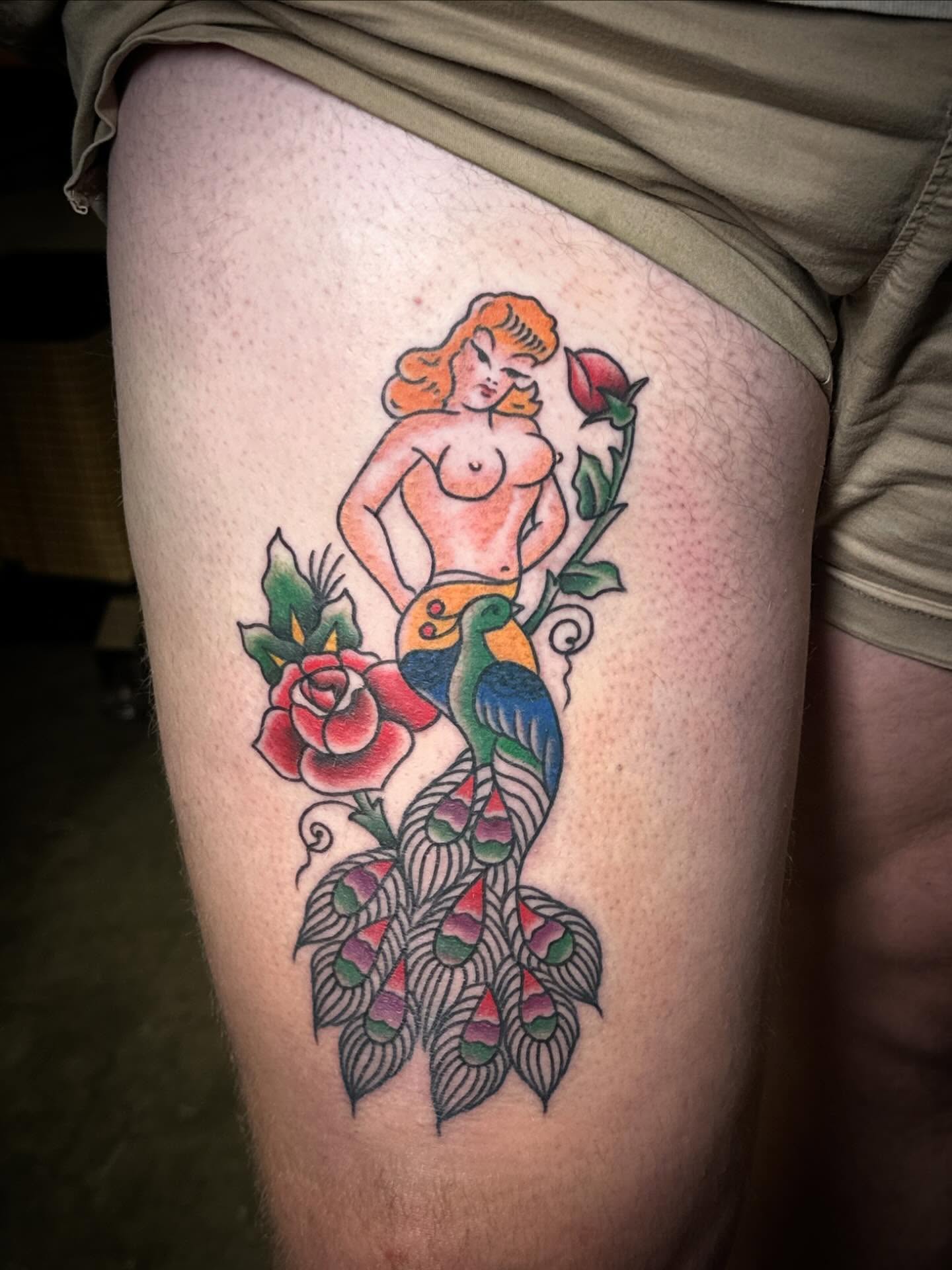 Mermaid and roses American traditional tattoo on the thigh by Kerri Colello Sittenauer