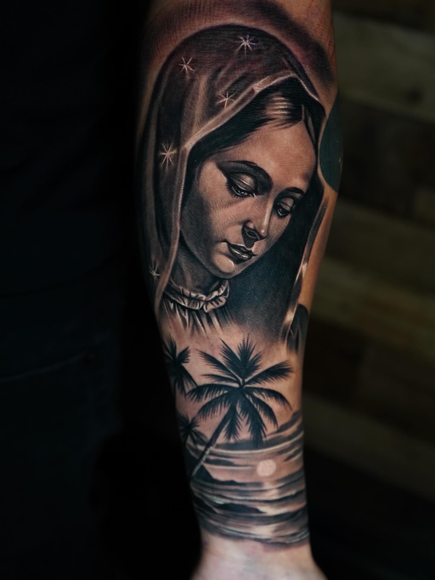 Woman with hood realism tattoo on the forearm by Edgar Campaña