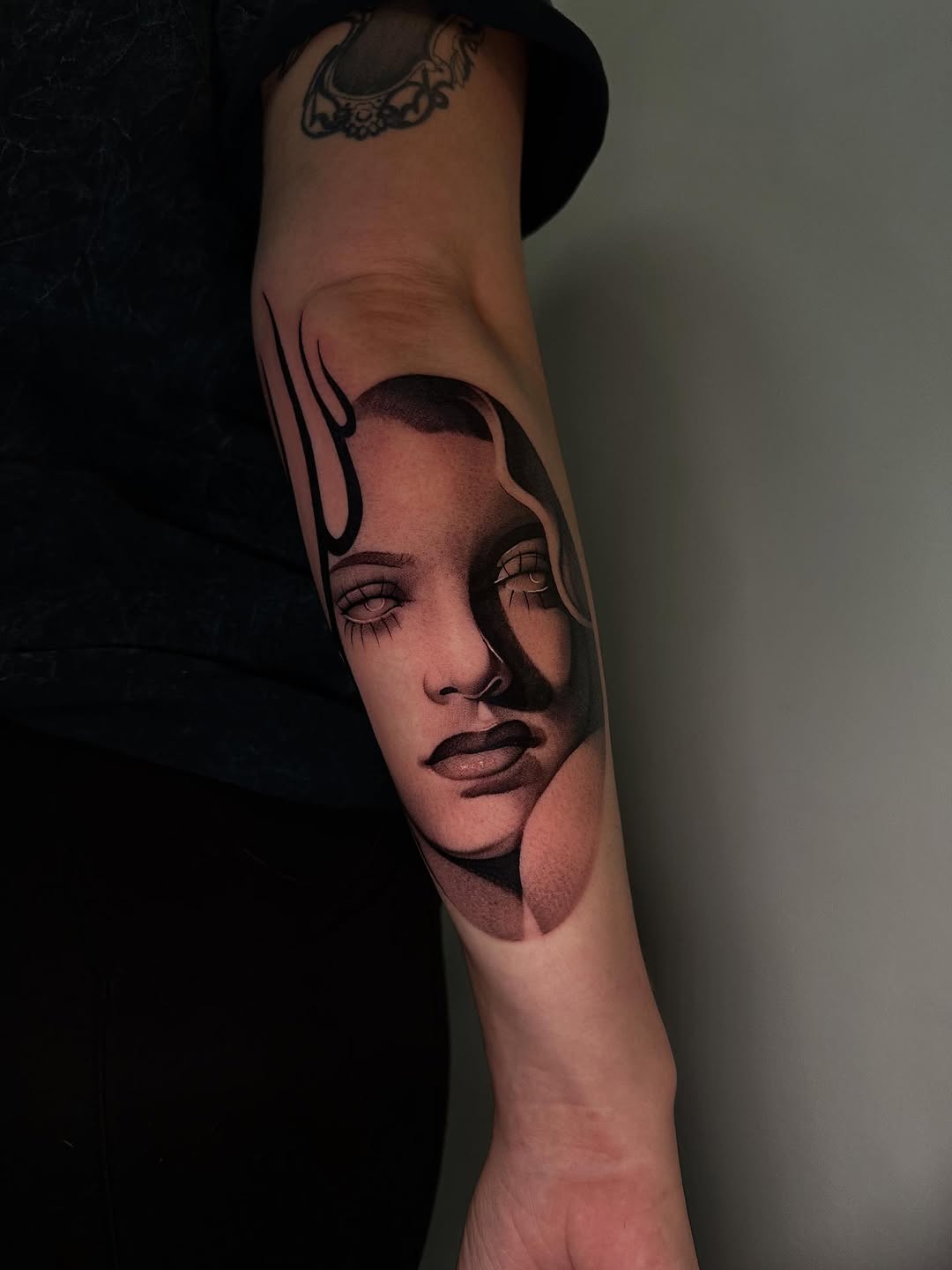 Portrait of a woman with flames realism tattoo on the forearm by @piinkywabbiit, Roselle Park, New Jersey