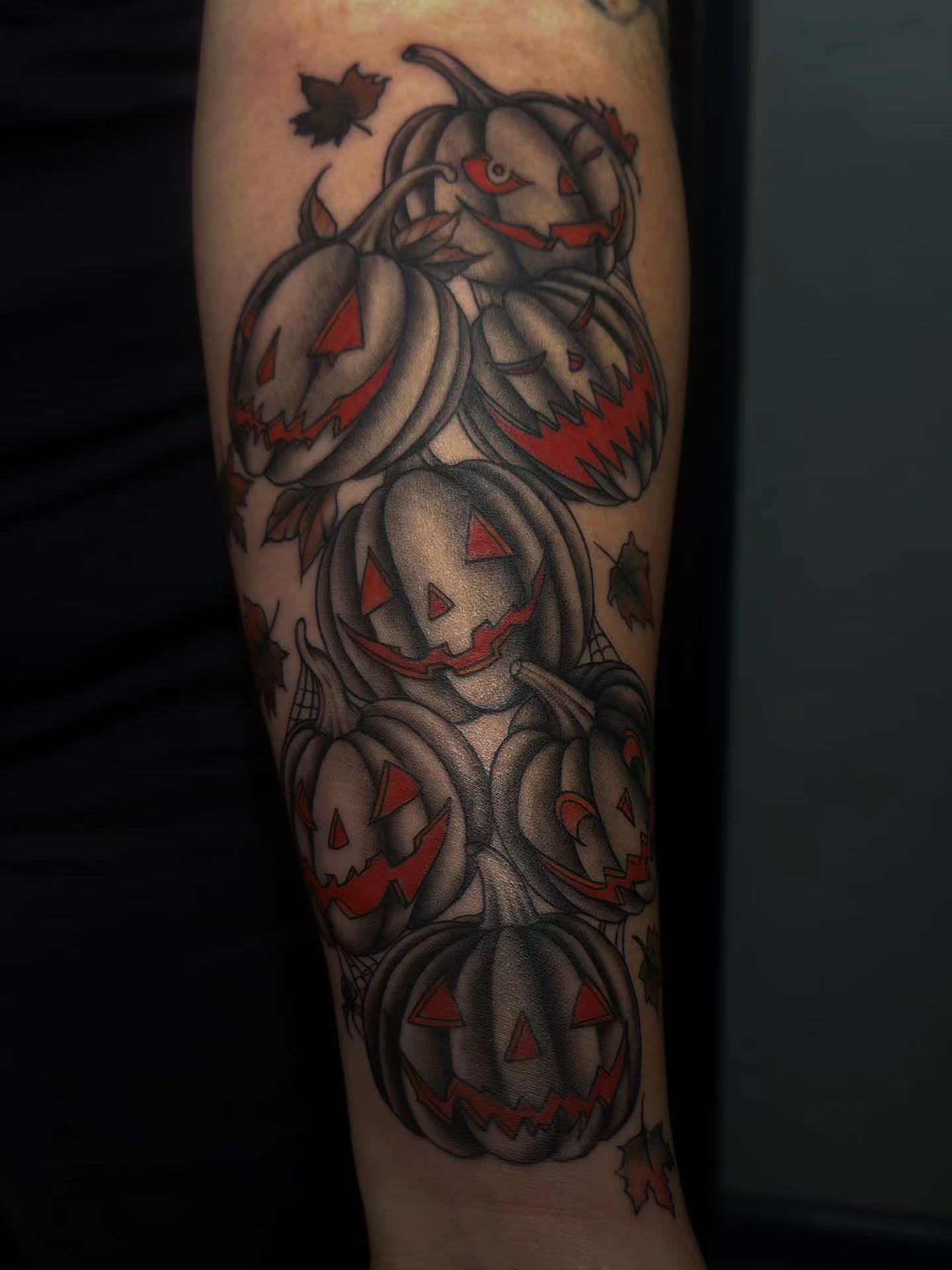 Jack-o'-lanterns American traditional tattoo on the forearm by Trinity