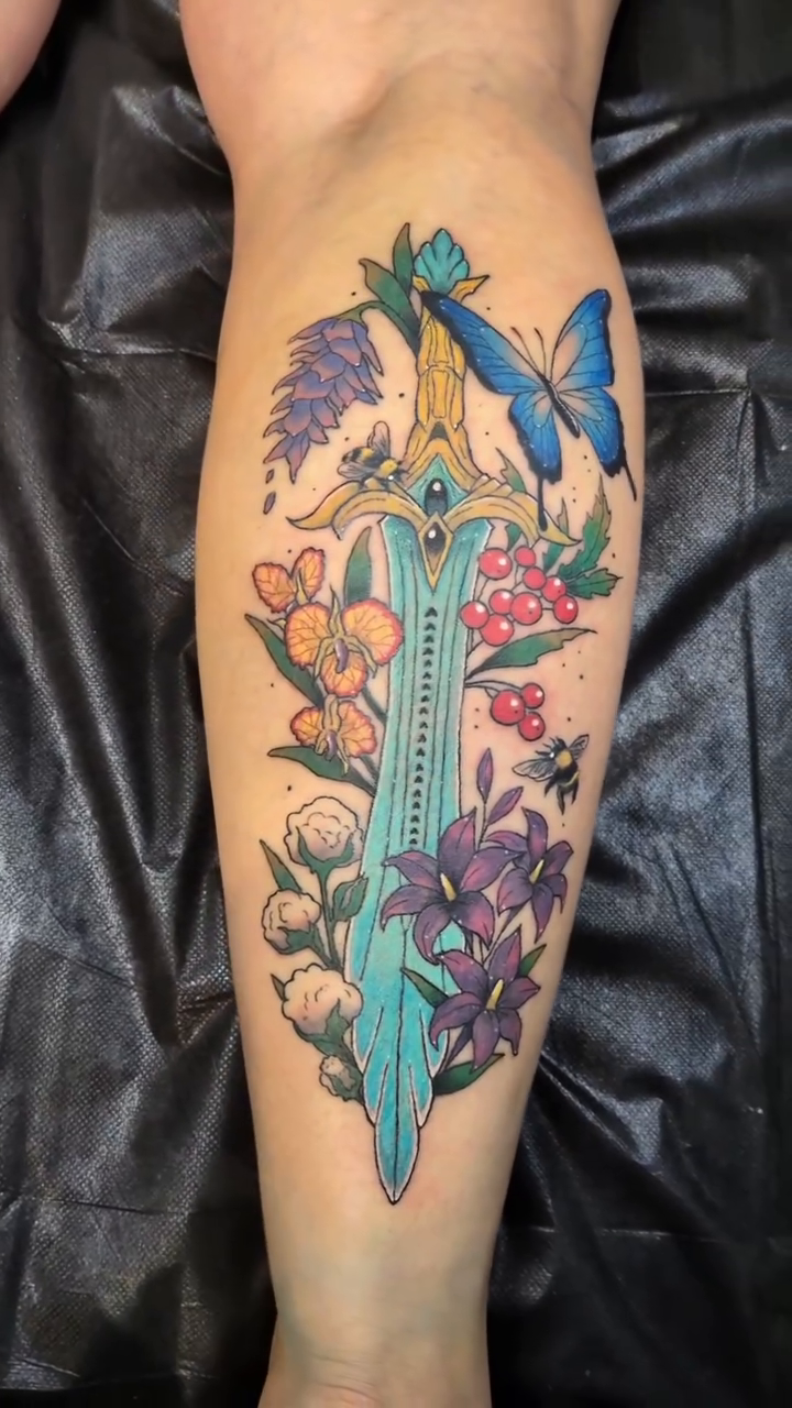 Sword with flowers and butterflies American traditional tattoo on the leg by Damon 🥀
