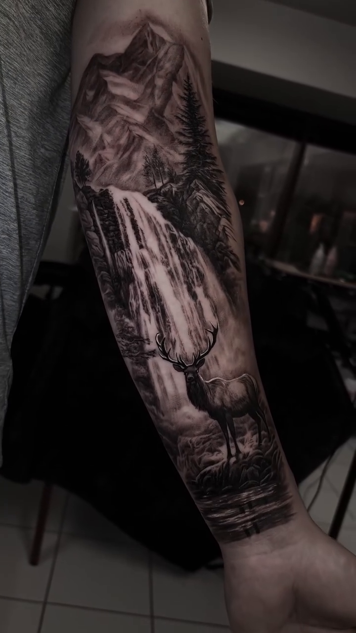 Waterfall and deer realism tattoo by Lynn Hoang, Honolulu, Hawaii