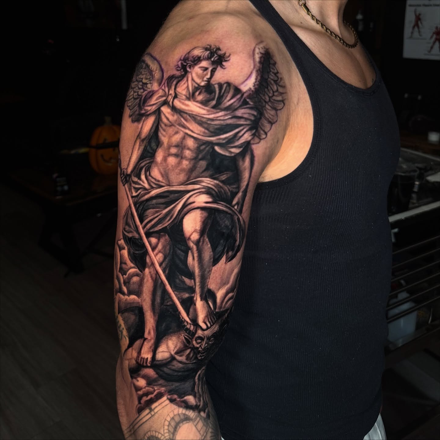 Angel with bow realism tattoo on the upper arm by Elian Sanchez Austin Tx. Tattoo Artist