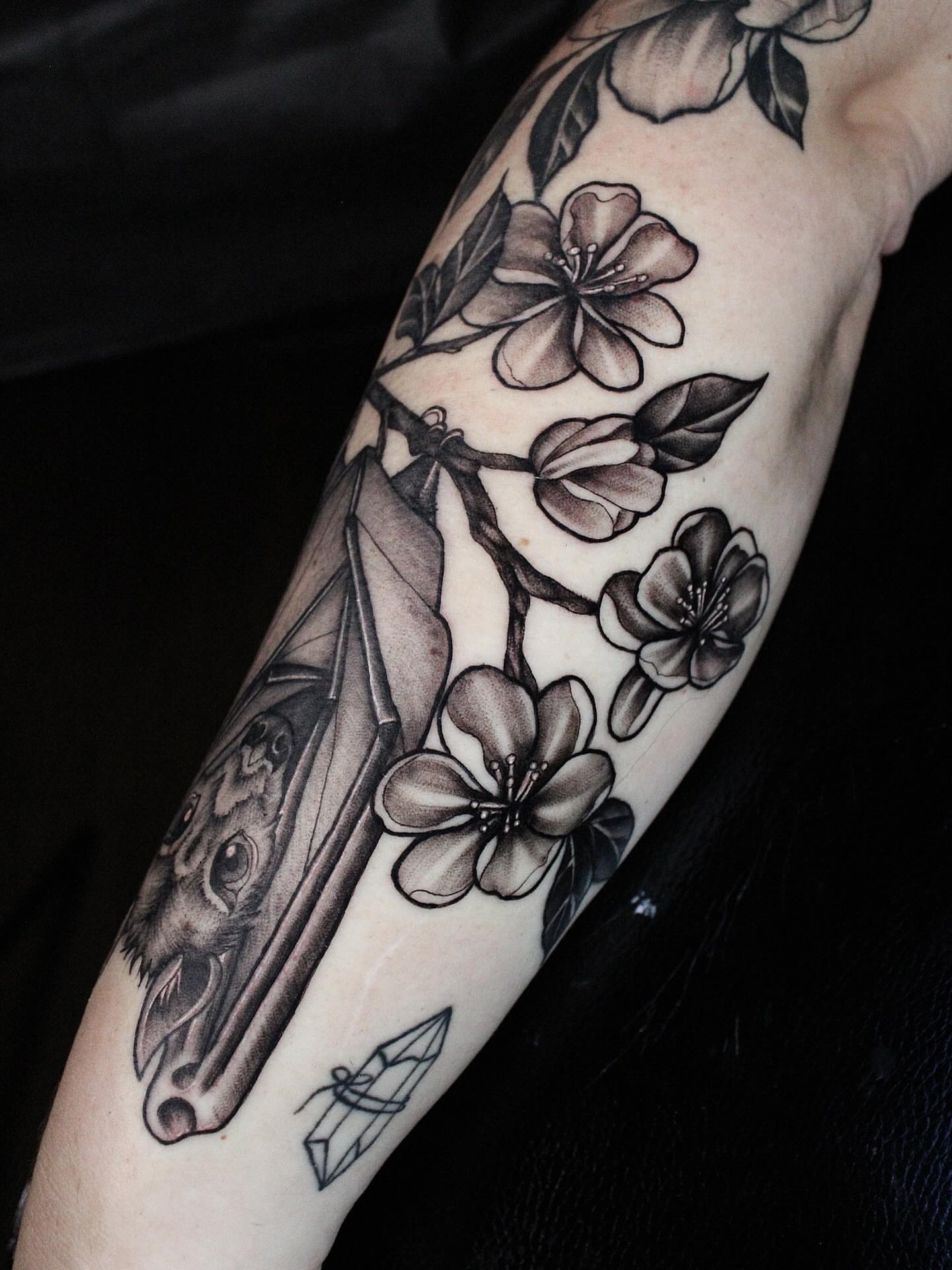 Cherry blossoms and bat American traditional tattoo on the forearm by 𝕵𝖎𝖒𝖎 𝕯𝖊𝕽𝖔𝖘𝖆🥀, Everett, Washington