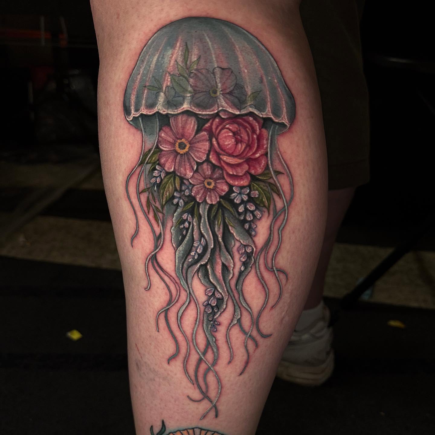 Jellyfish with flowers new school tattoo on the thigh by Cassandra Sanik, Ballston Spa, New York