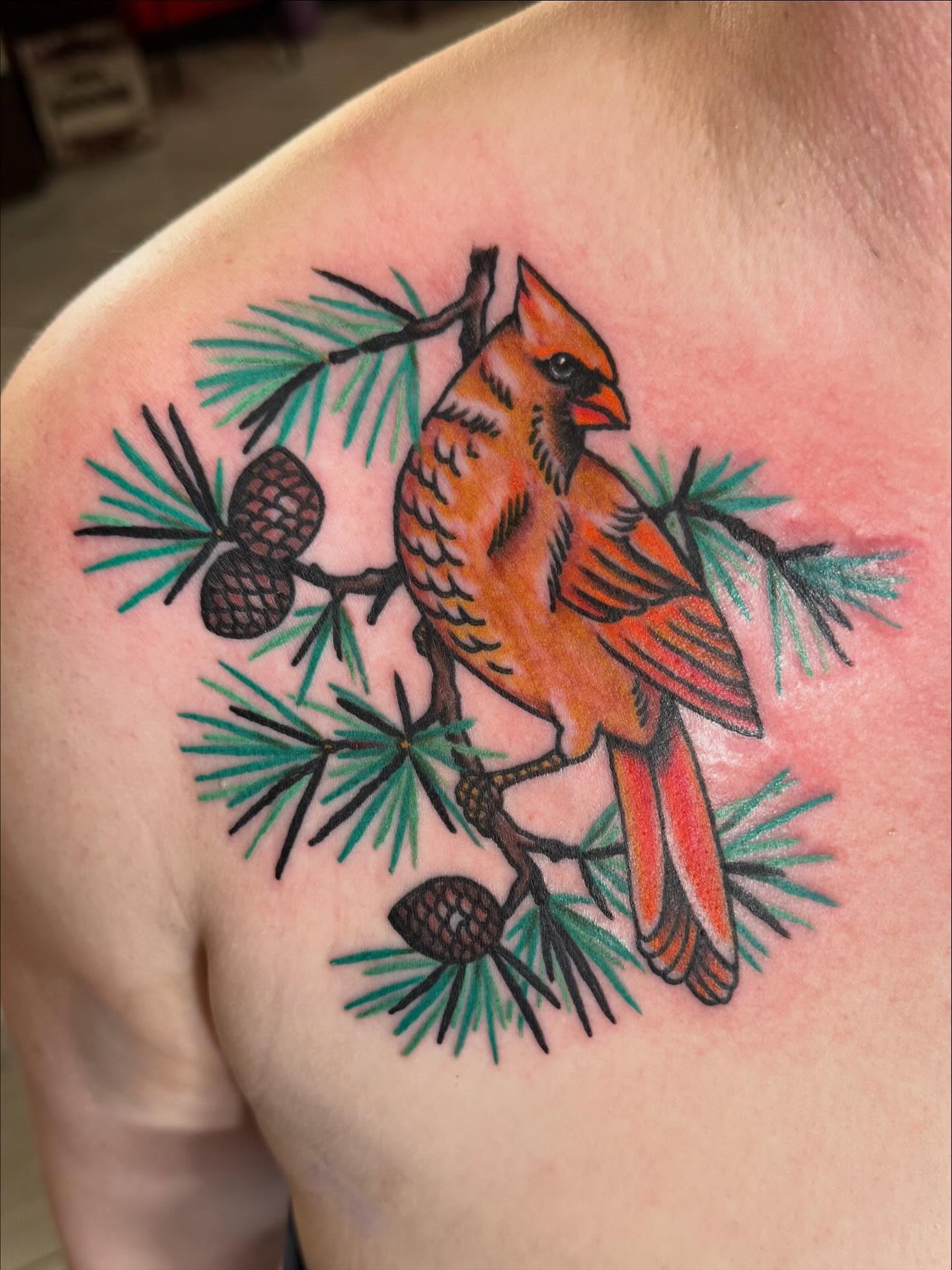 Cardinal bird American traditional tattoo on the shoulder by Bill Crawford, Plymouth, Michigan