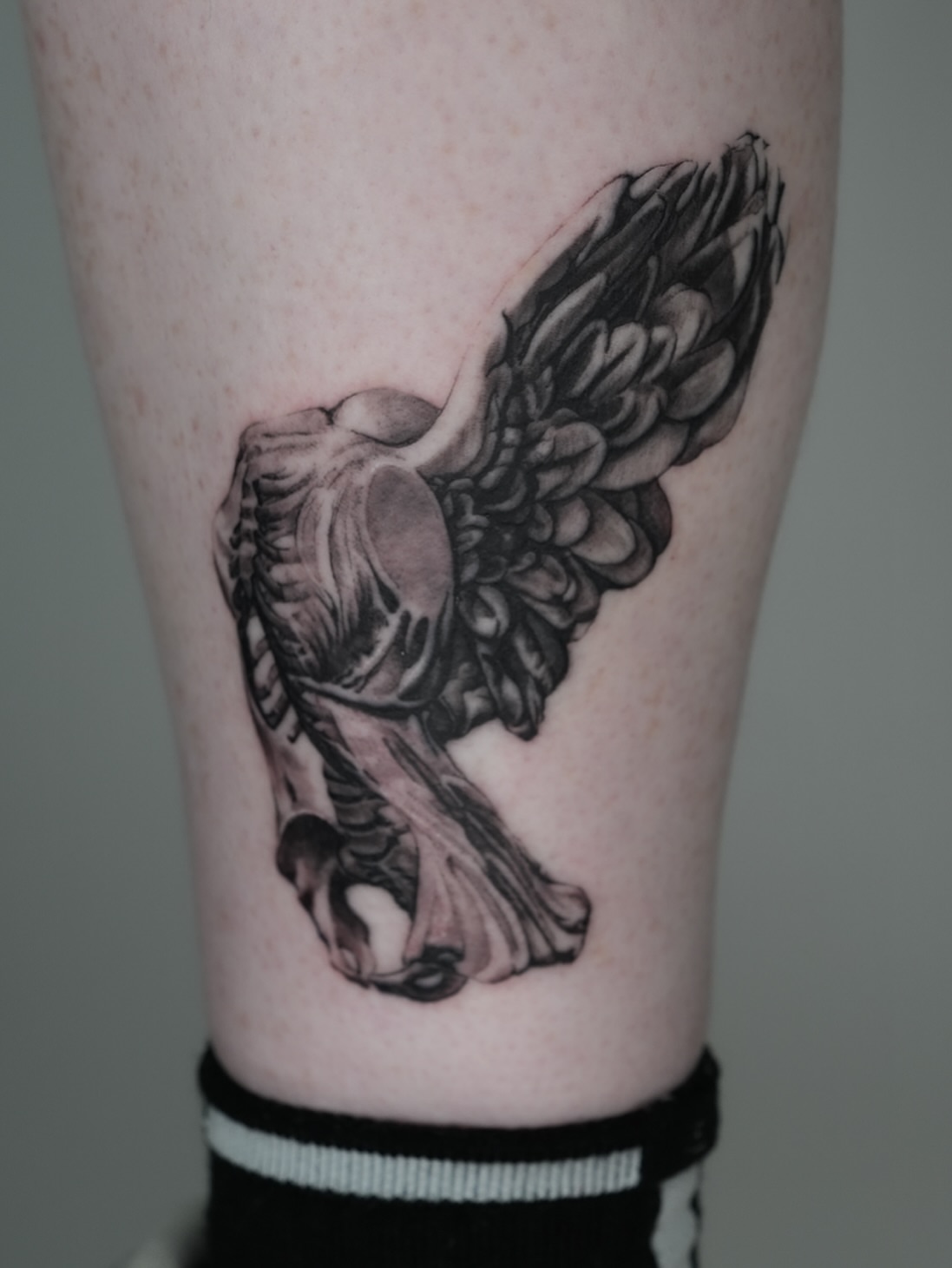 Winged creature realism tattoo on the forearm by Tiffany