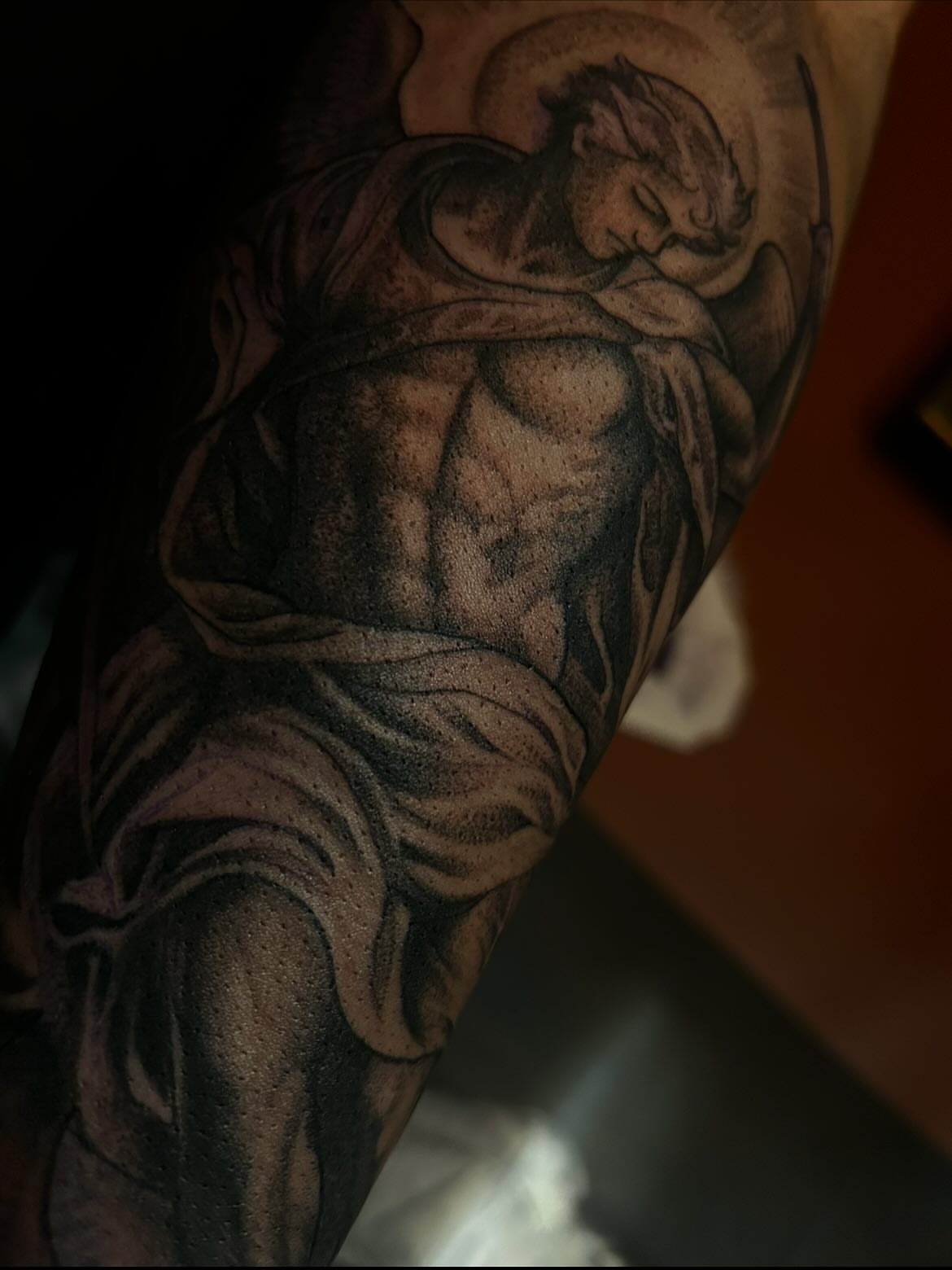 Angel black and grey tattoo on the forearm by Carlos