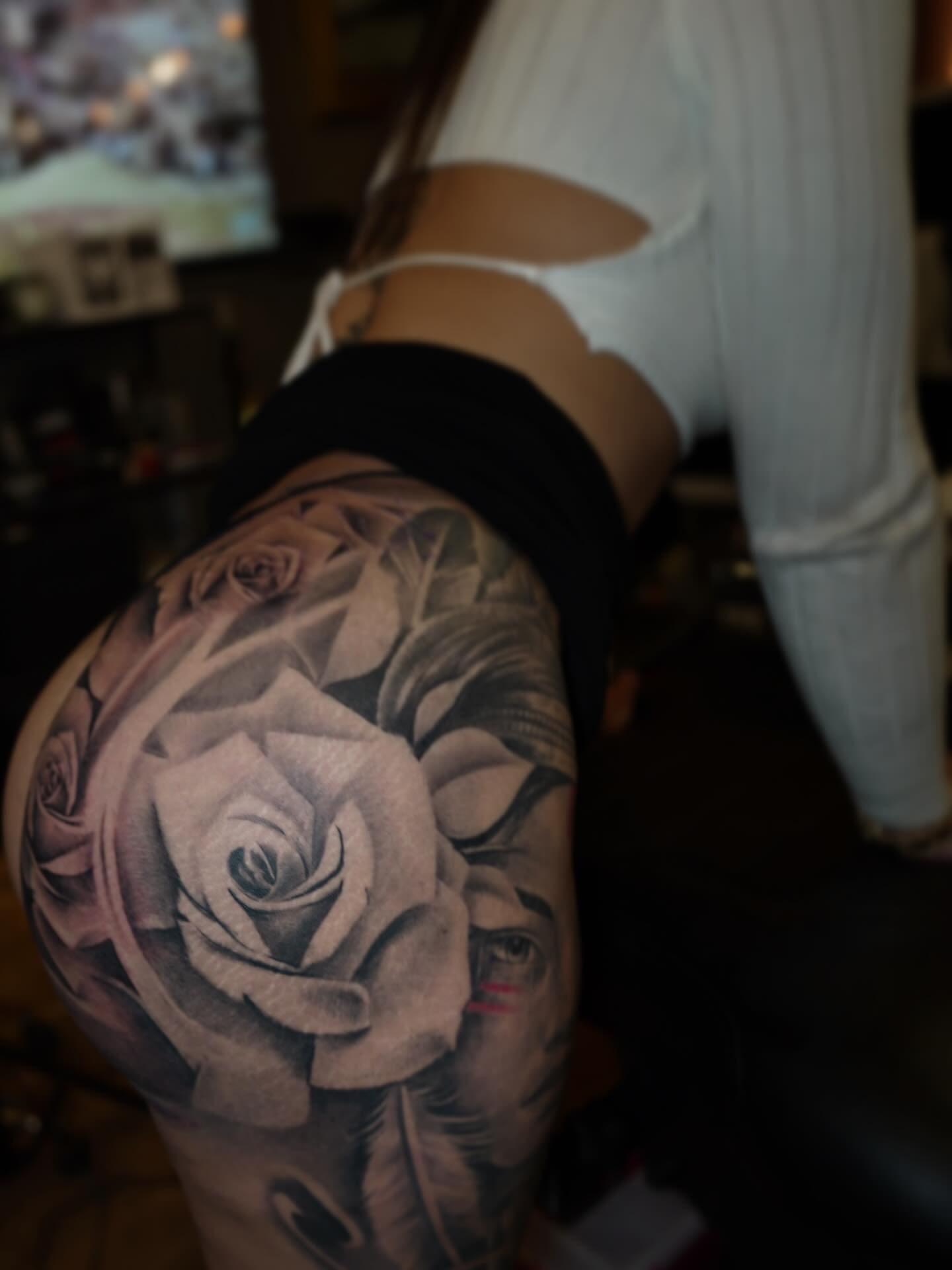 Rose realism tattoo on the thigh by Erick Satchell II