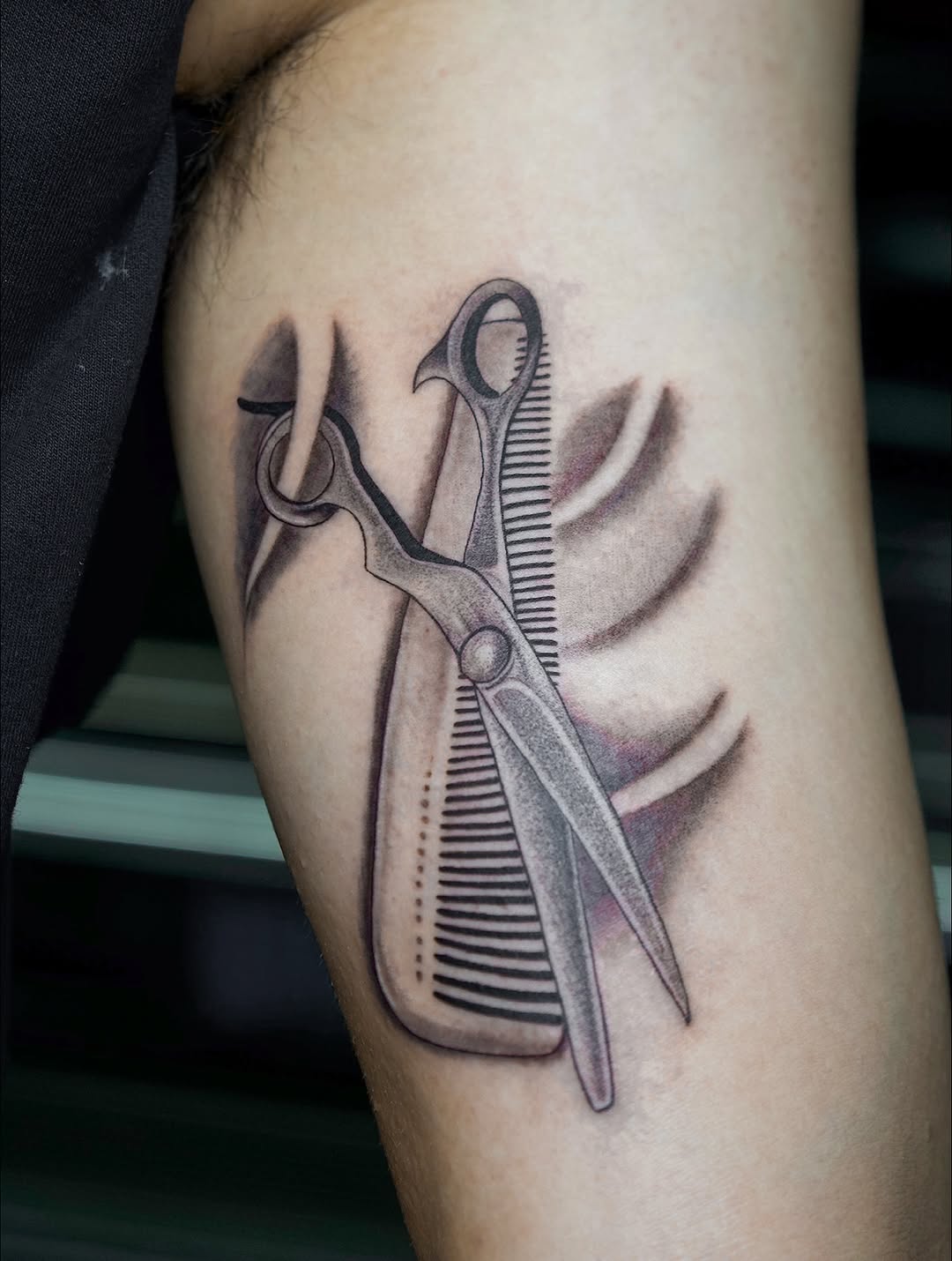 Scissors and comb surrealism tattoo on the forearm by ππππππ