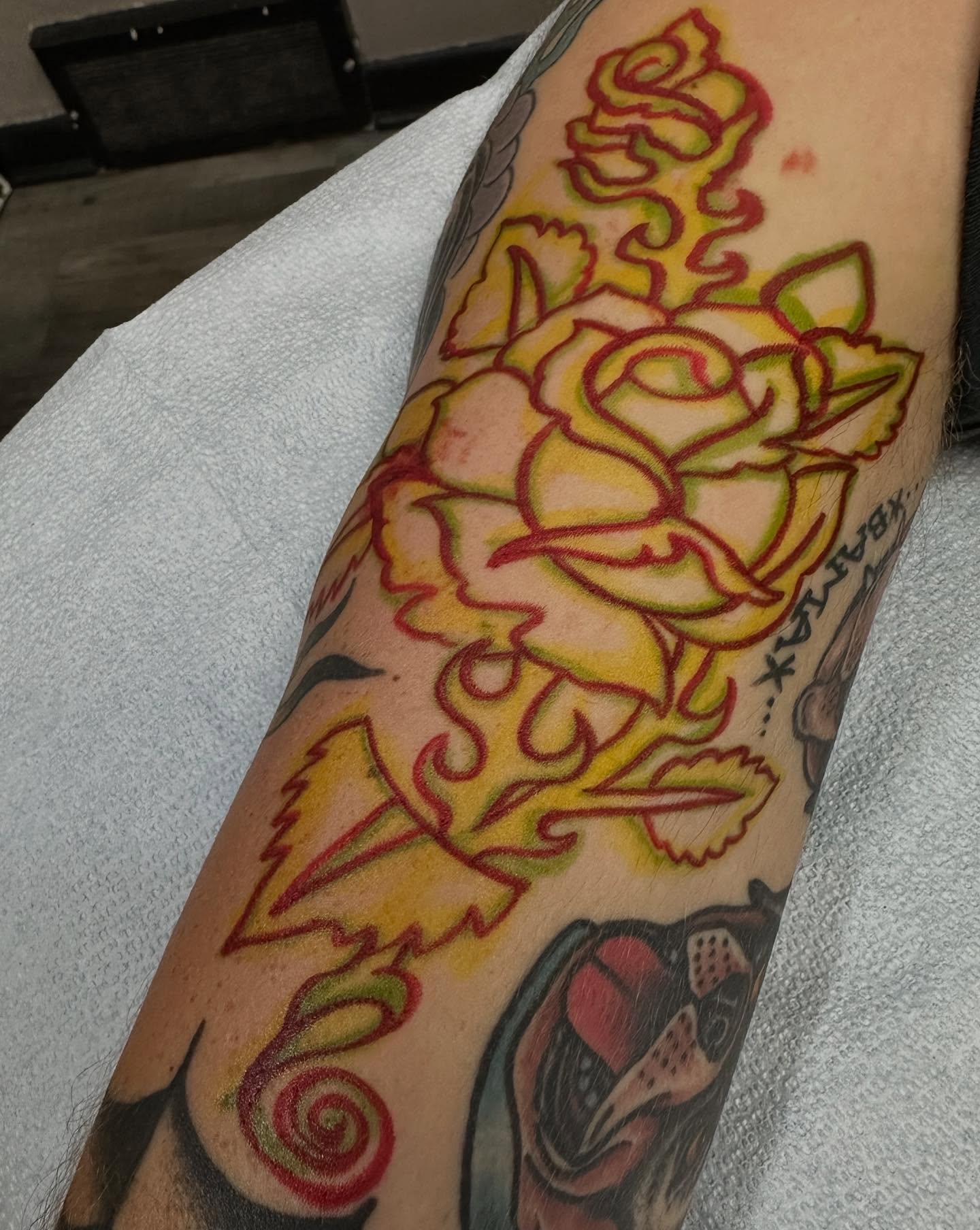 Rose American traditional tattoo on the forearm by Devin Spenny