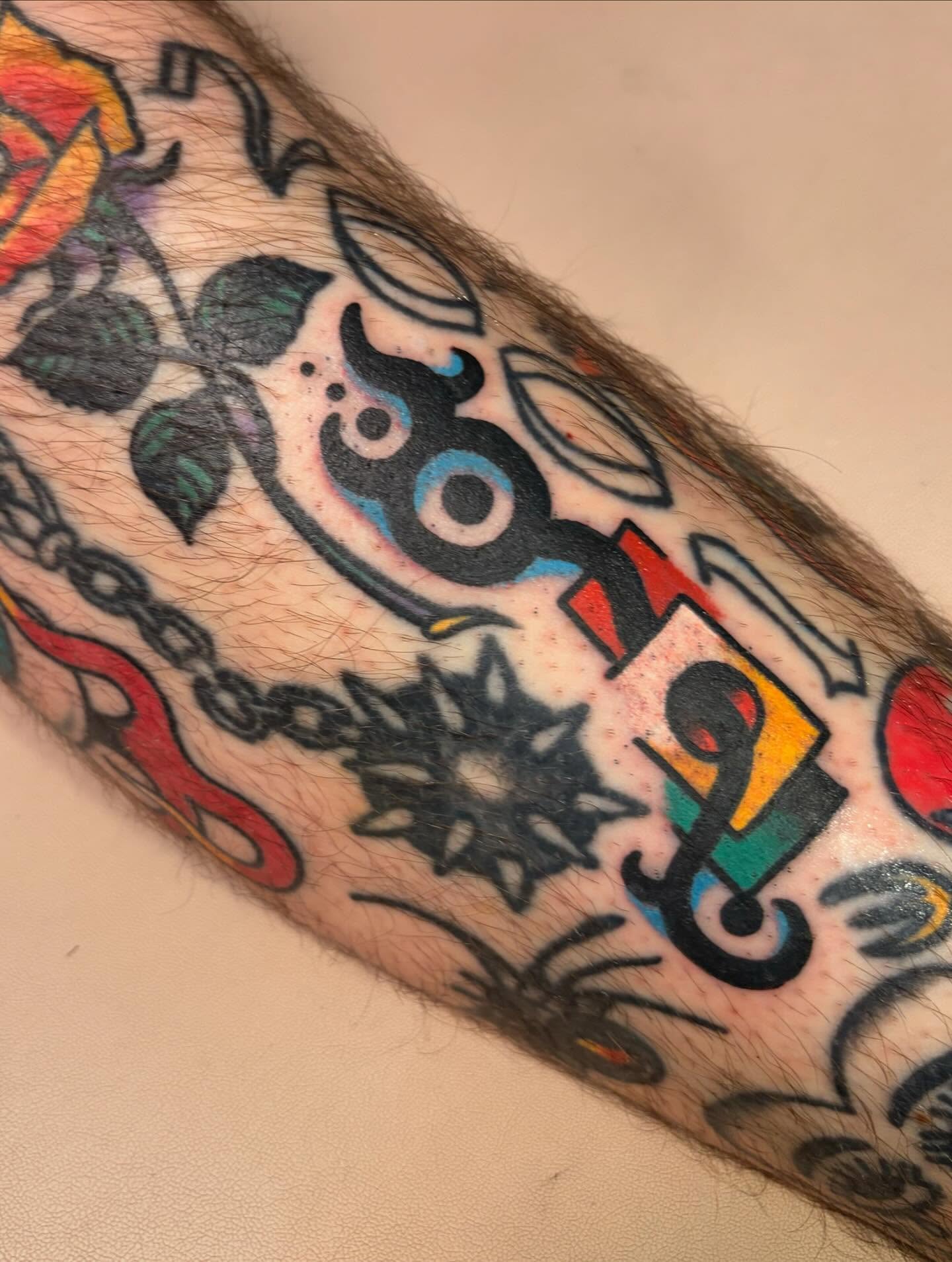 Abstract design American traditional tattoo on the forearm by Jack, Knoxville, Tennessee
