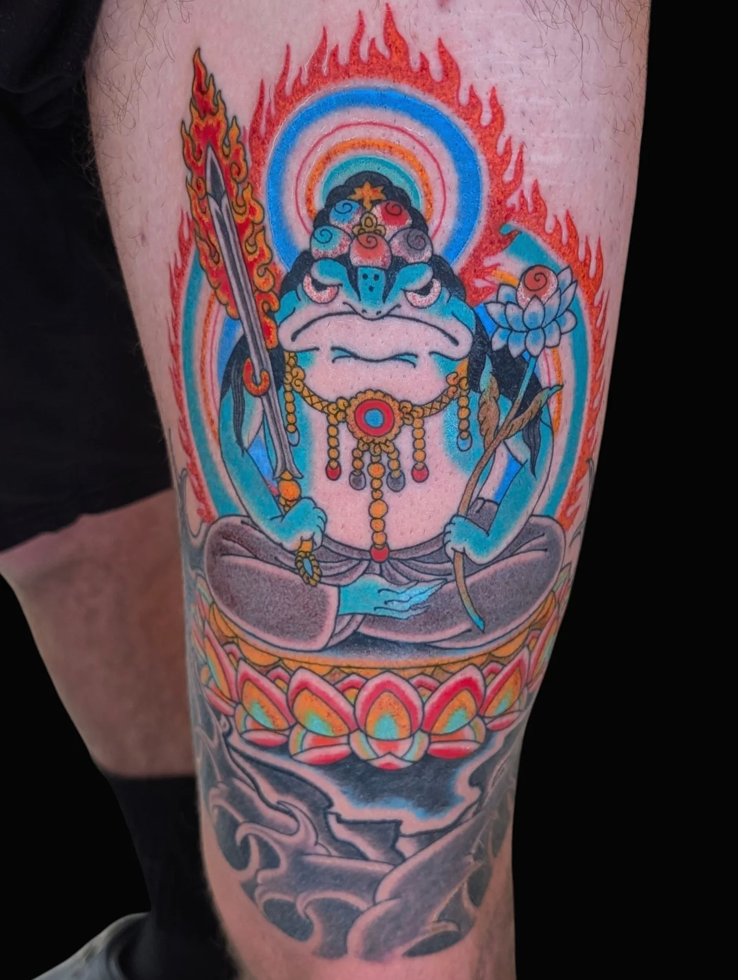 Meditation pose with deity new school tattoo on the calf by Angela Mukai