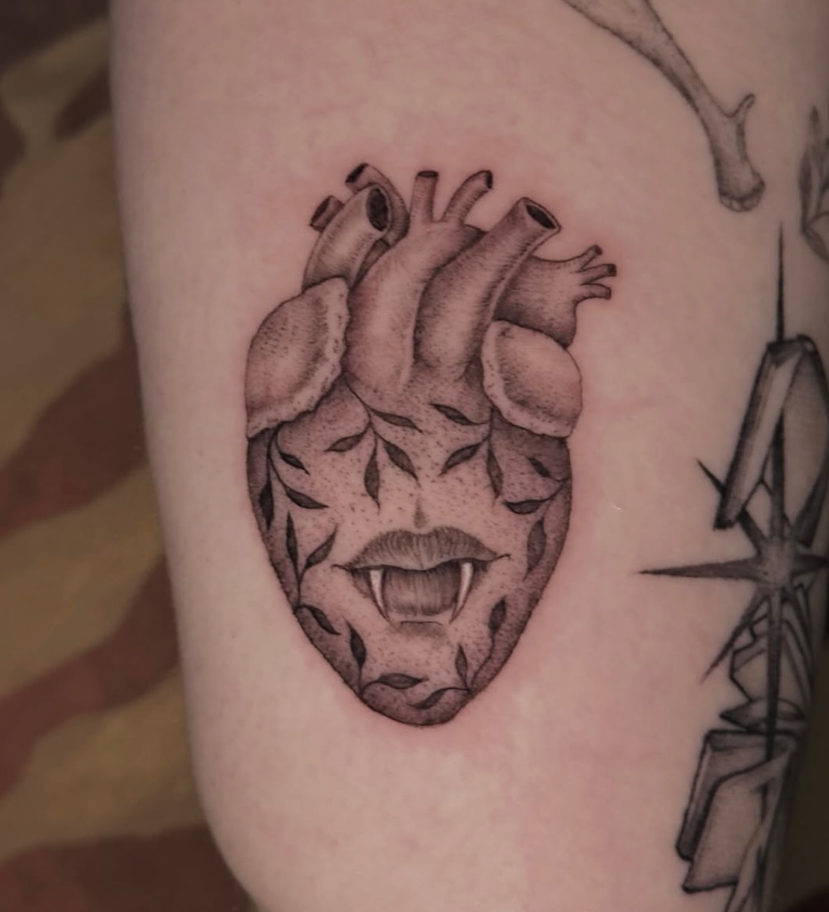 Heart with mouth realism tattoo on the thigh by Carmen Figueroa, New York, New York