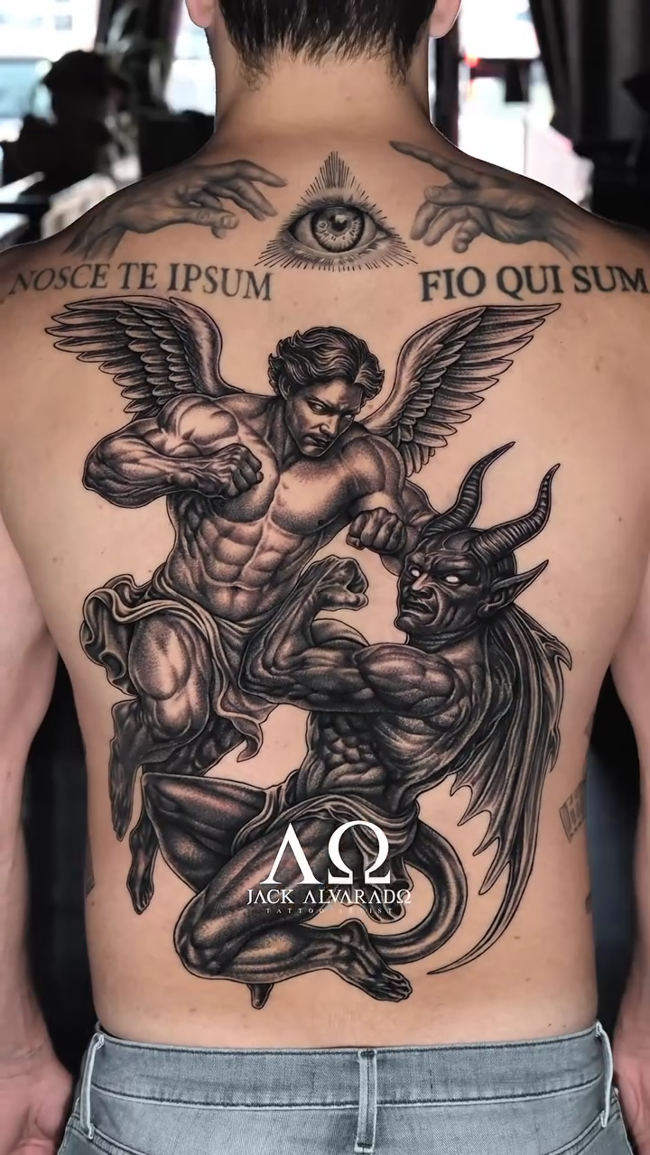 Angel fighting a demon realism tattoo by Jack Alvarado.