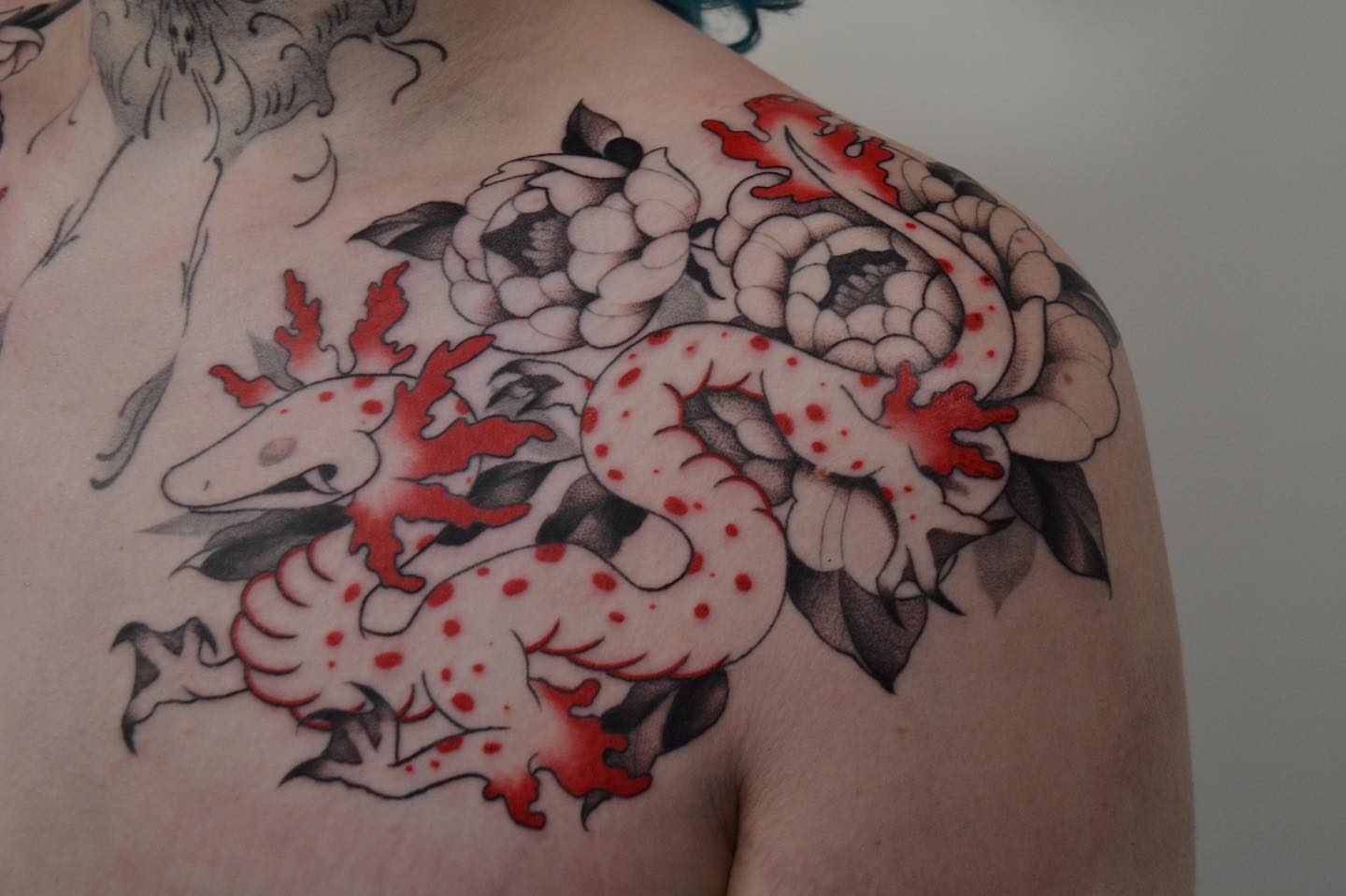 Snake and peony japanese irezumi tattoo on the shoulder by Vanessa Acosta