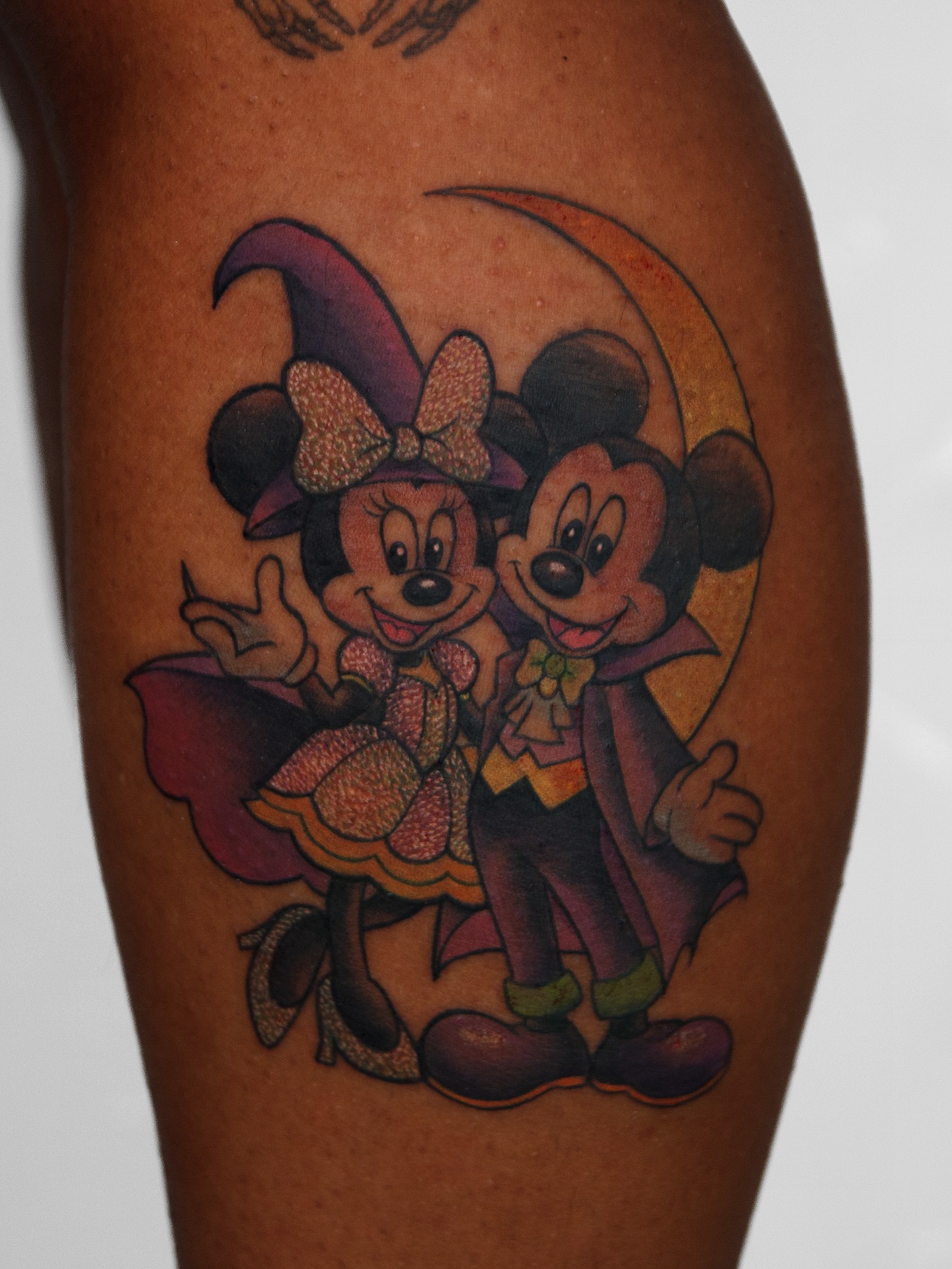Minnie mouse and mickey mouse dotwork tattoo on the forearm by caliope yiannos