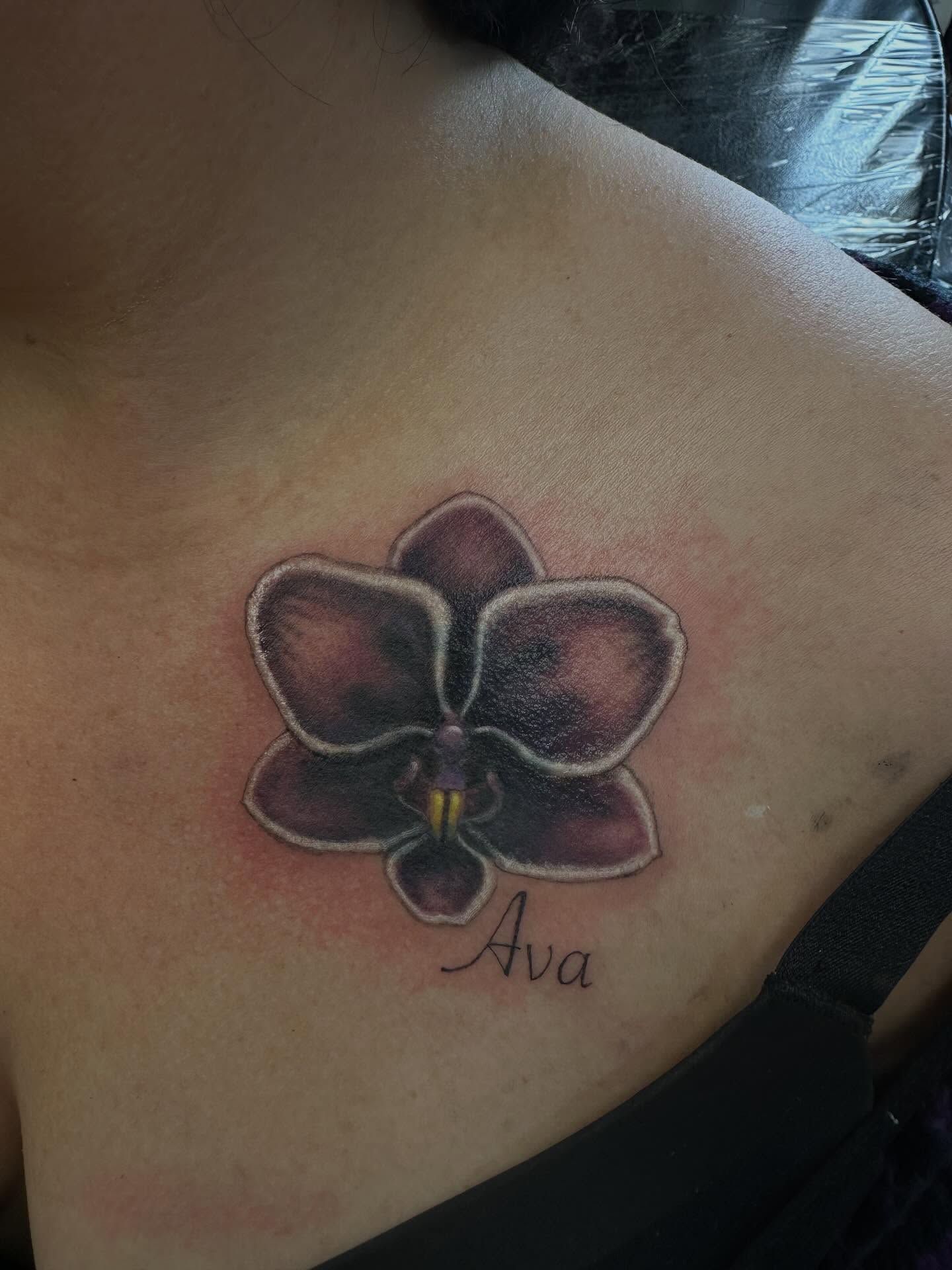 Orchid realism tattoo on the chest by Marie Novotny, Lakewood, Ohio