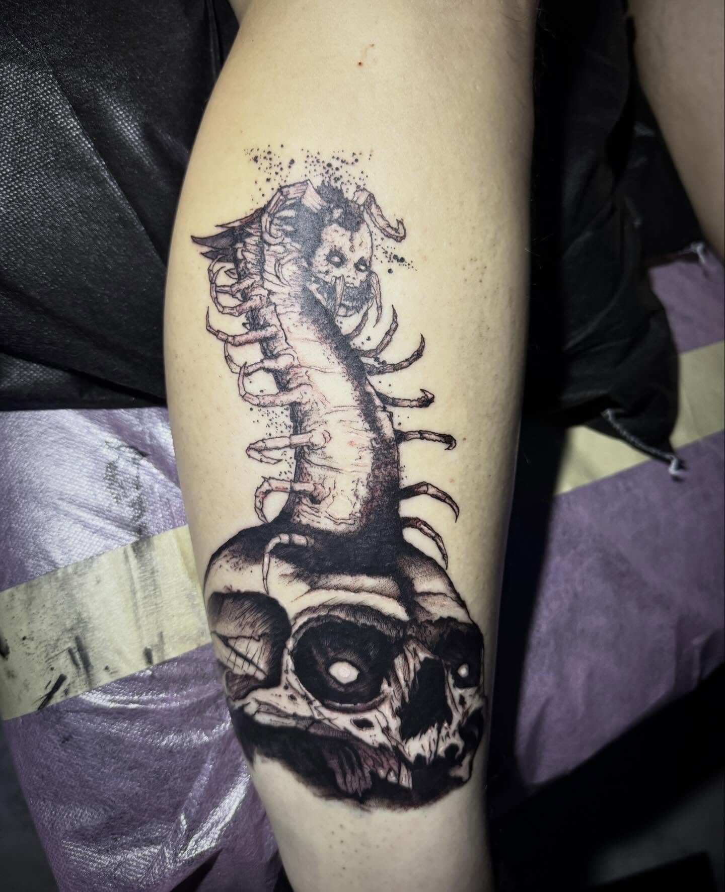 Spine and skull dotwork tattoo on the forearm by AaronAdlerTattoos.com, Cincinnati