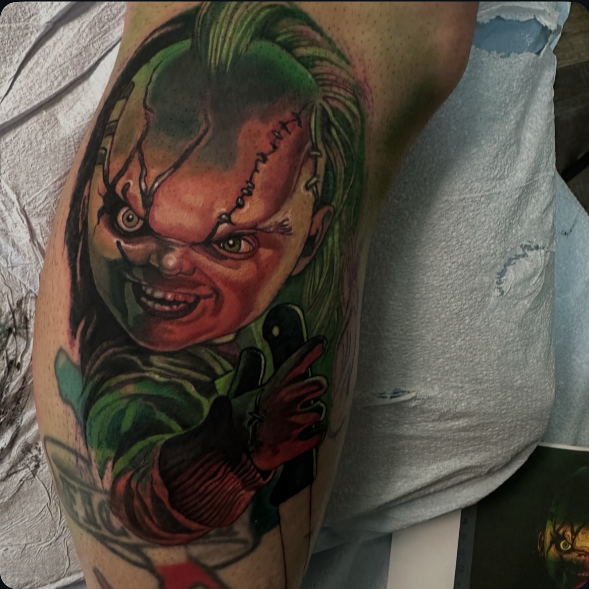 Chucky realism tattoo on the forearm by John Tarrao, Berwyn, Pennsylvania