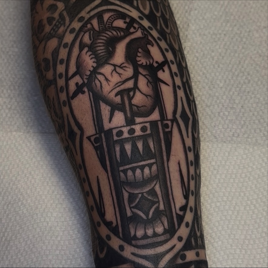 Heart with horns American traditional tattoo on the forearm by Cory Allen