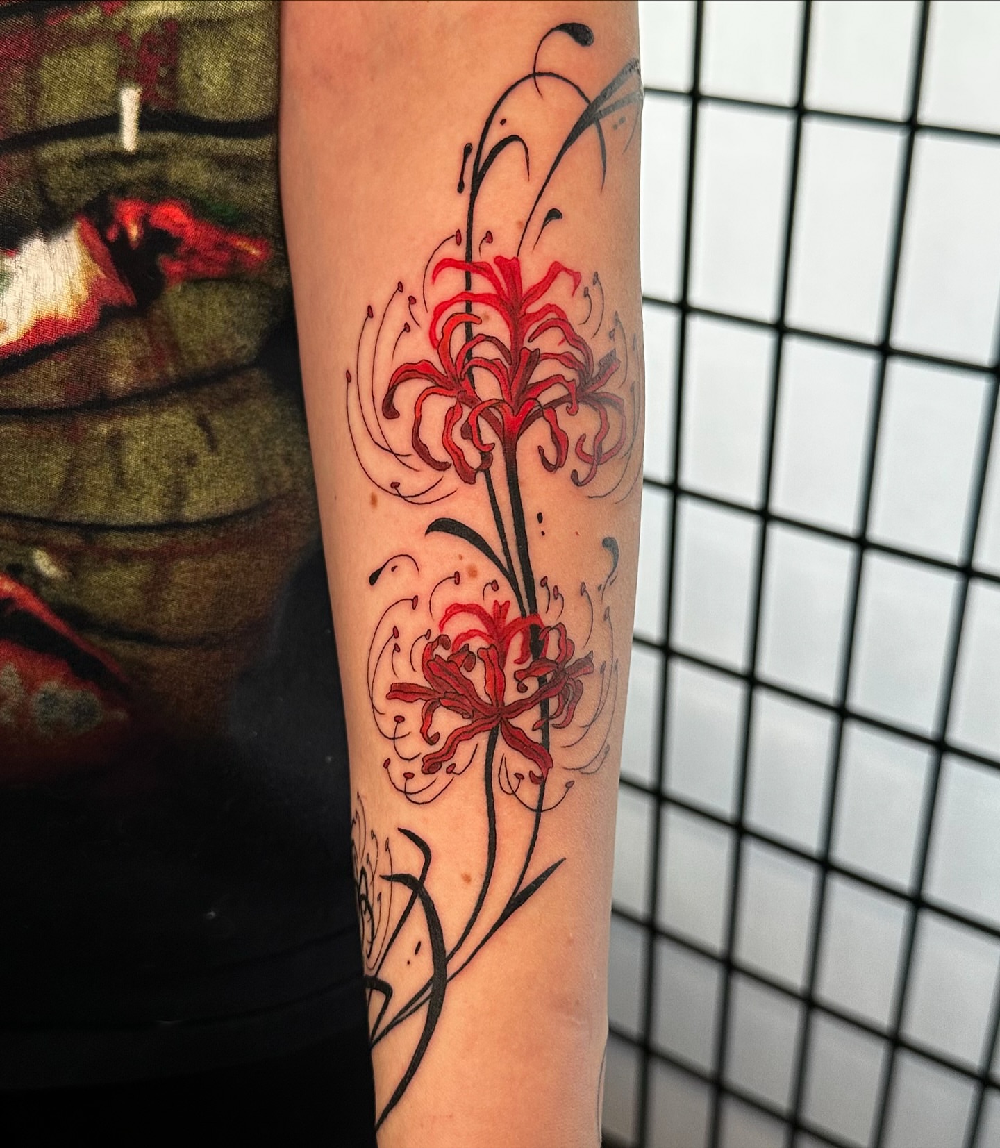 Red spider lilies japanese irezumi tattoo on the forearm by Taylin Johnson- Illustrative Blackwork, Columbus, Ohio