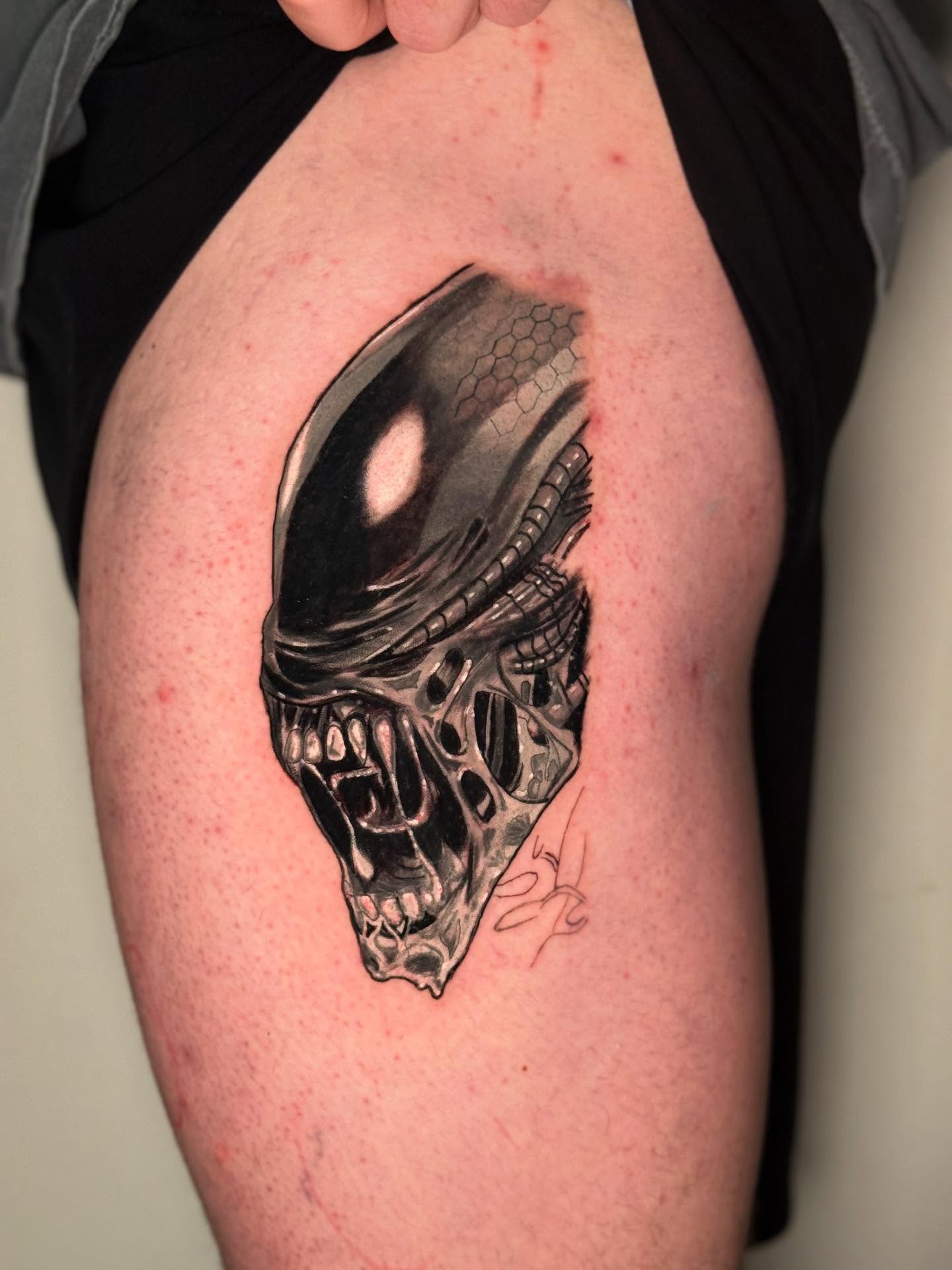 Alien head realism tattoo on the thigh by dotMX