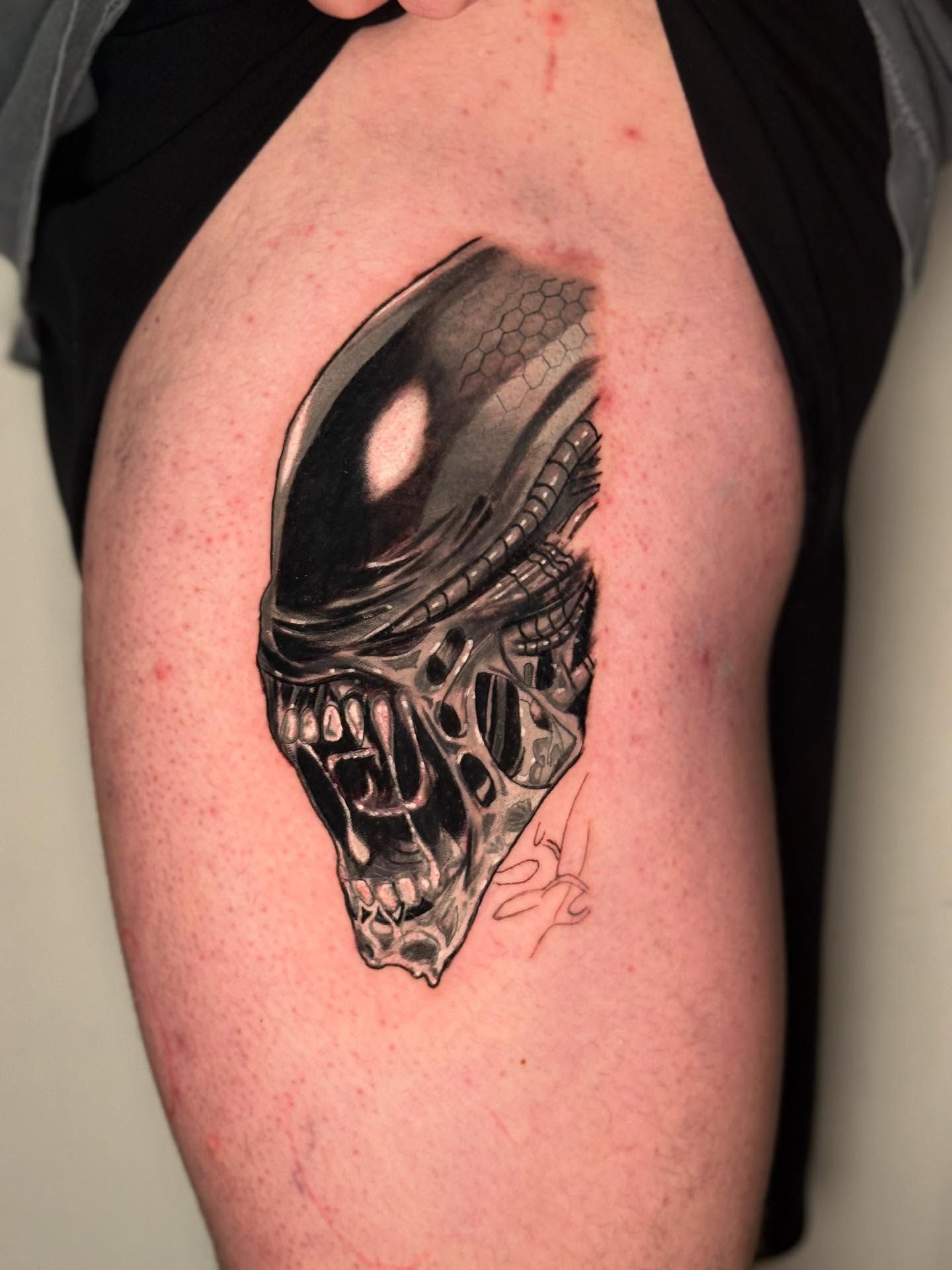 Alien head realism tattoo on the thigh by dotMX
