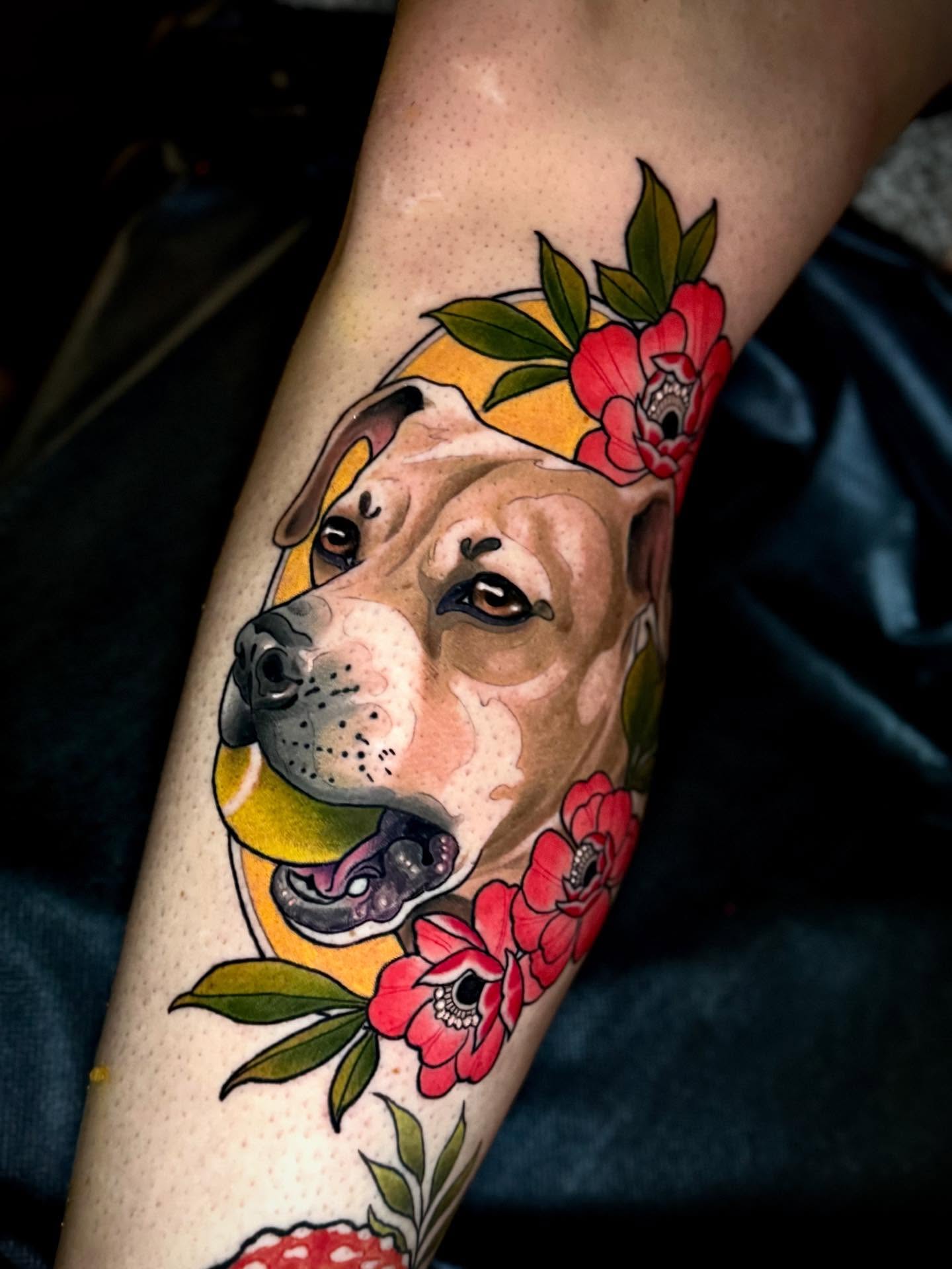 Pit bull with flowers realism tattoo on the forearm by Andi Fitz ✨ San Diego Tattoo Artist, San Diego, California