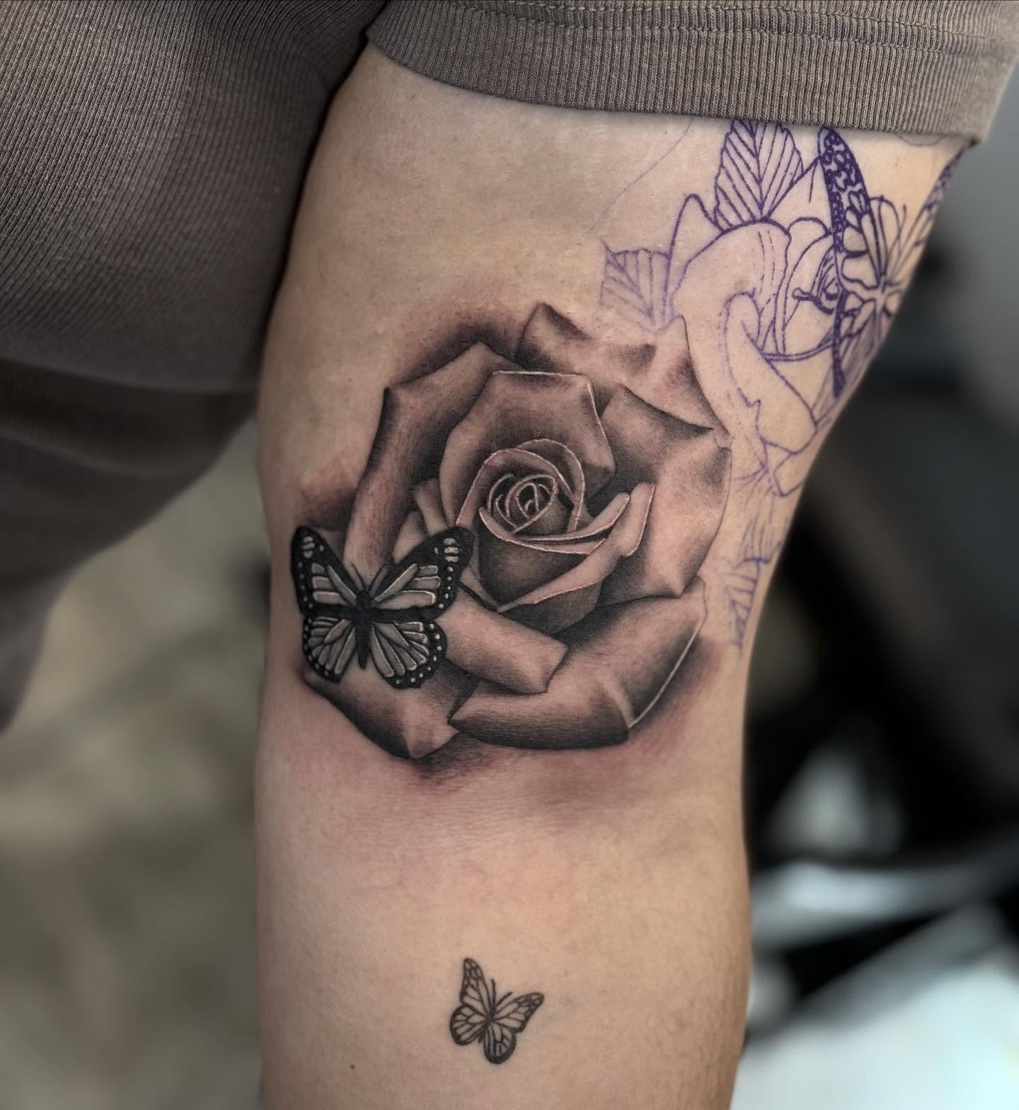 Rose and butterfly realism tattoo on the forearm by Aaron Carey, Salem, Oregon