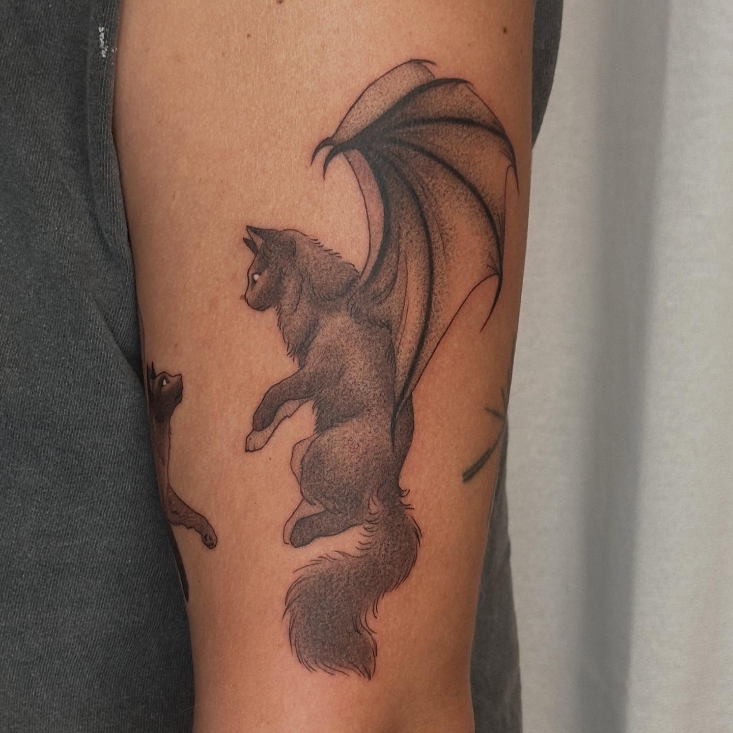 Winged cat dotwork tattoo on the forearm by ɪᴍᴏɢᴇɴ 🏳️🌈 sᴇᴀᴛᴛʟᴇ ᴛᴀᴛᴛᴏᴏ ᴀʀᴛɪsᴛ, Seattle, Washington
