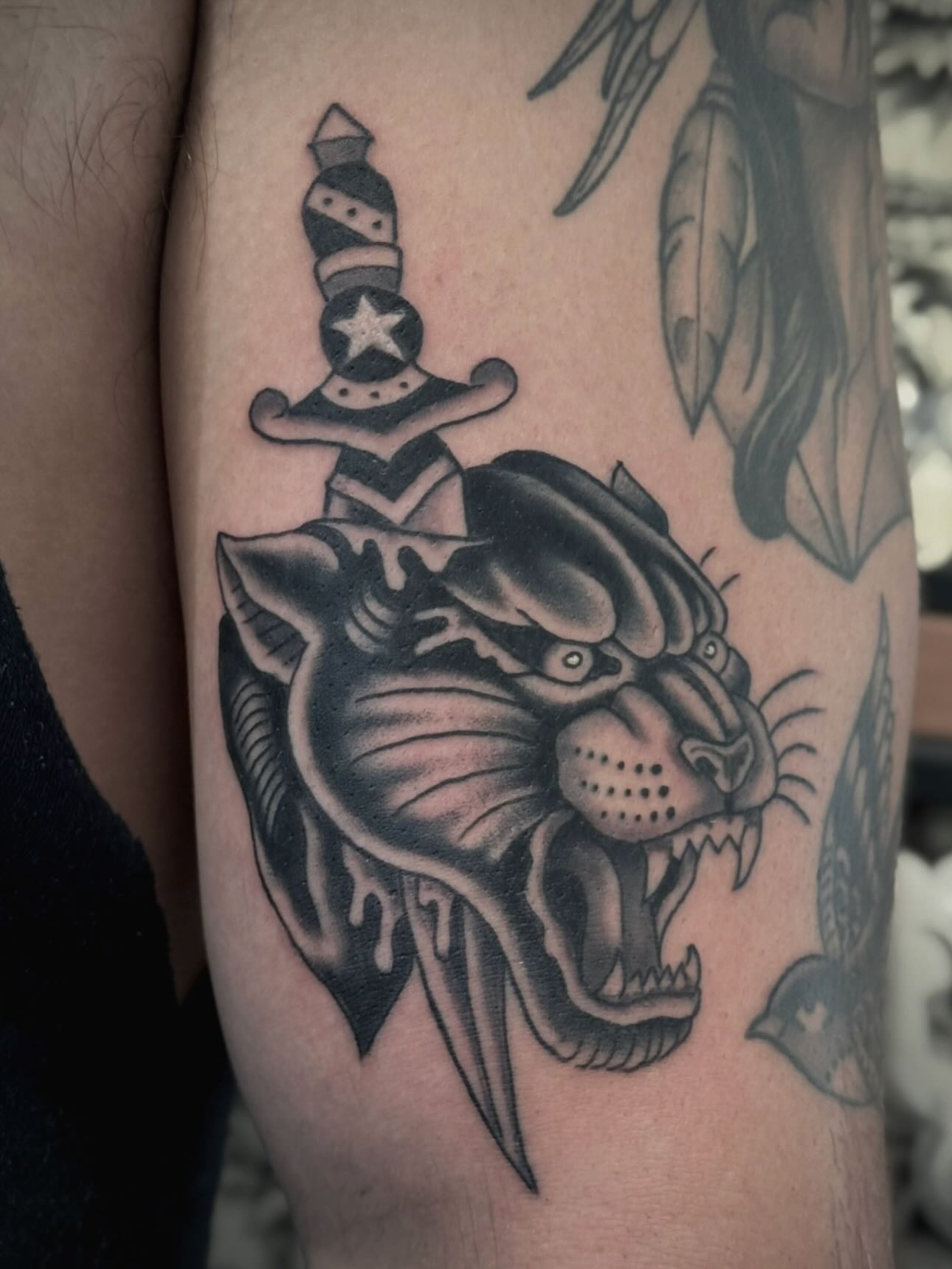 Panther with top hat American traditional tattoo on the forearm by Micah Norman, San Francisco, California