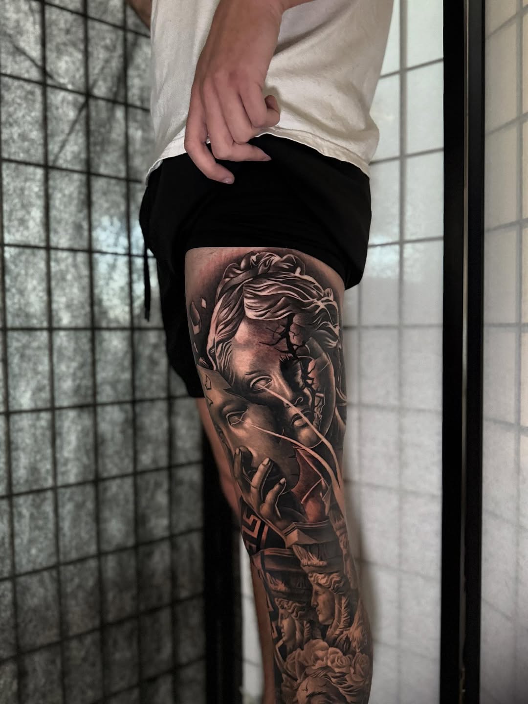 Classical sculpture realism tattoo on the leg by Miles Johnson