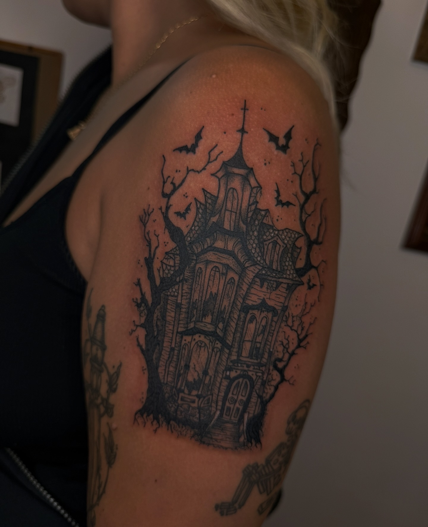 Haunted house dark realism tattoo on the shoulder by Eden H., Columbus, Ohio
