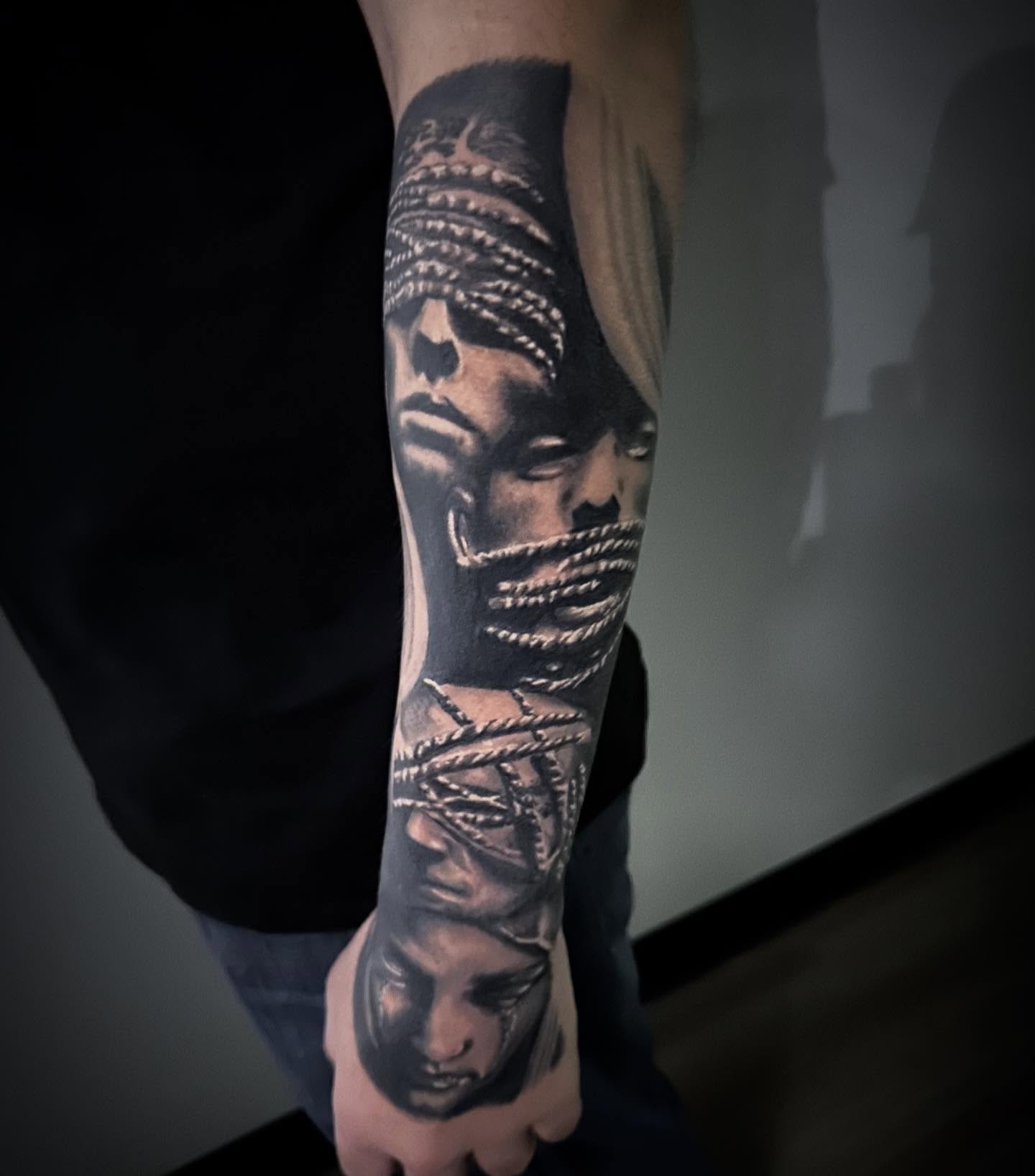 Bound man realism tattoo on the forearm by Neil5one3