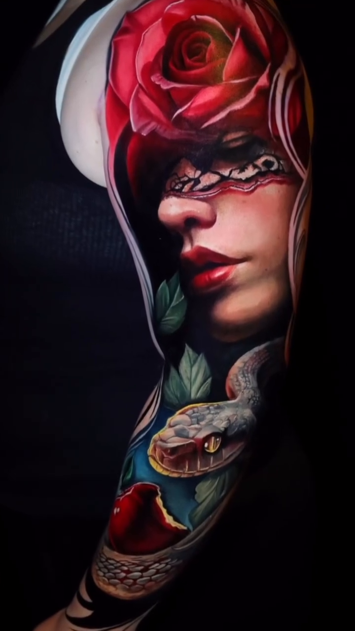 Woman with rose and snake realism tattoo by Maryssa Anne