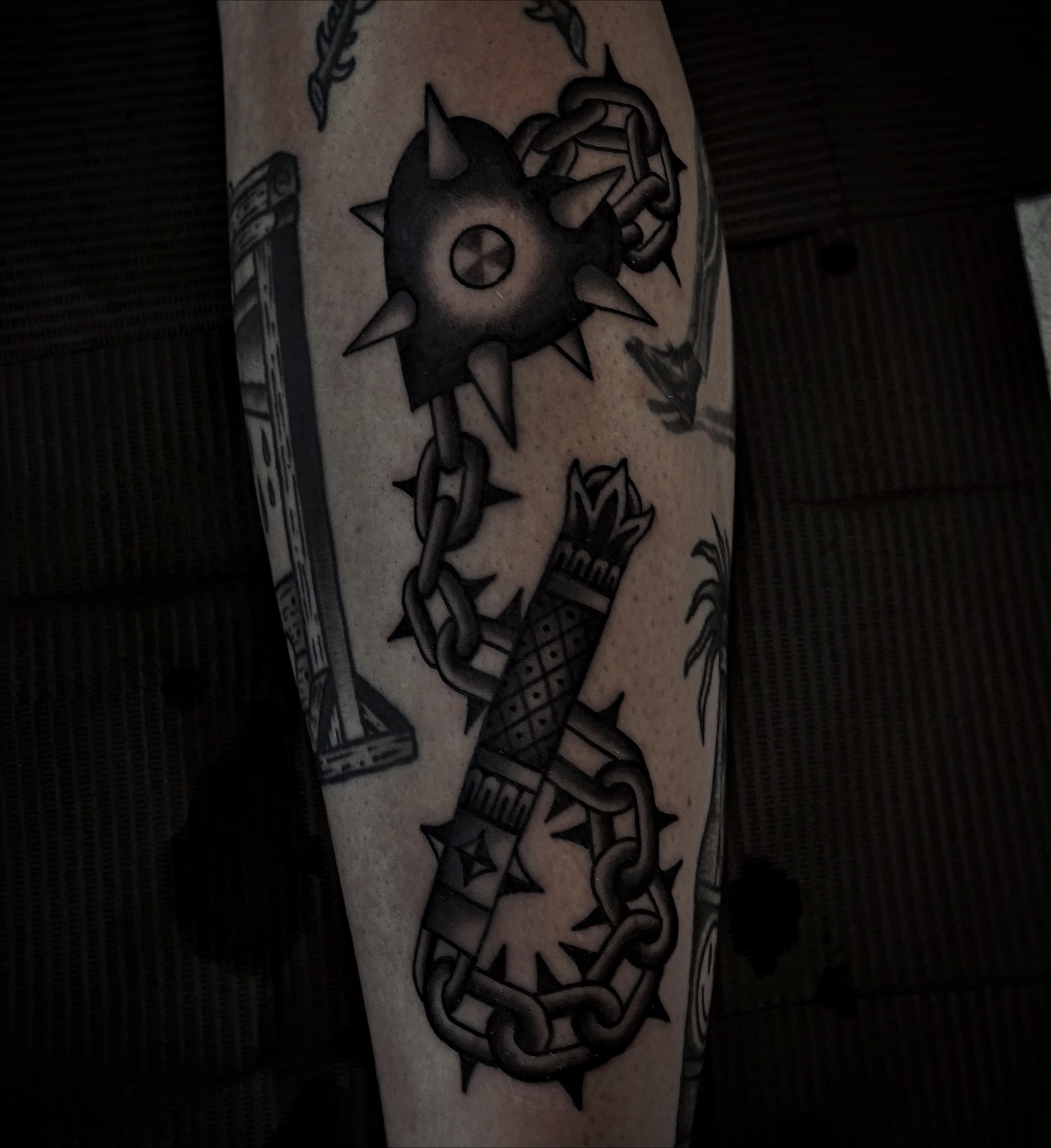 Chain and spiked ball geometric tattoo on the forearm by Brandon Murphy