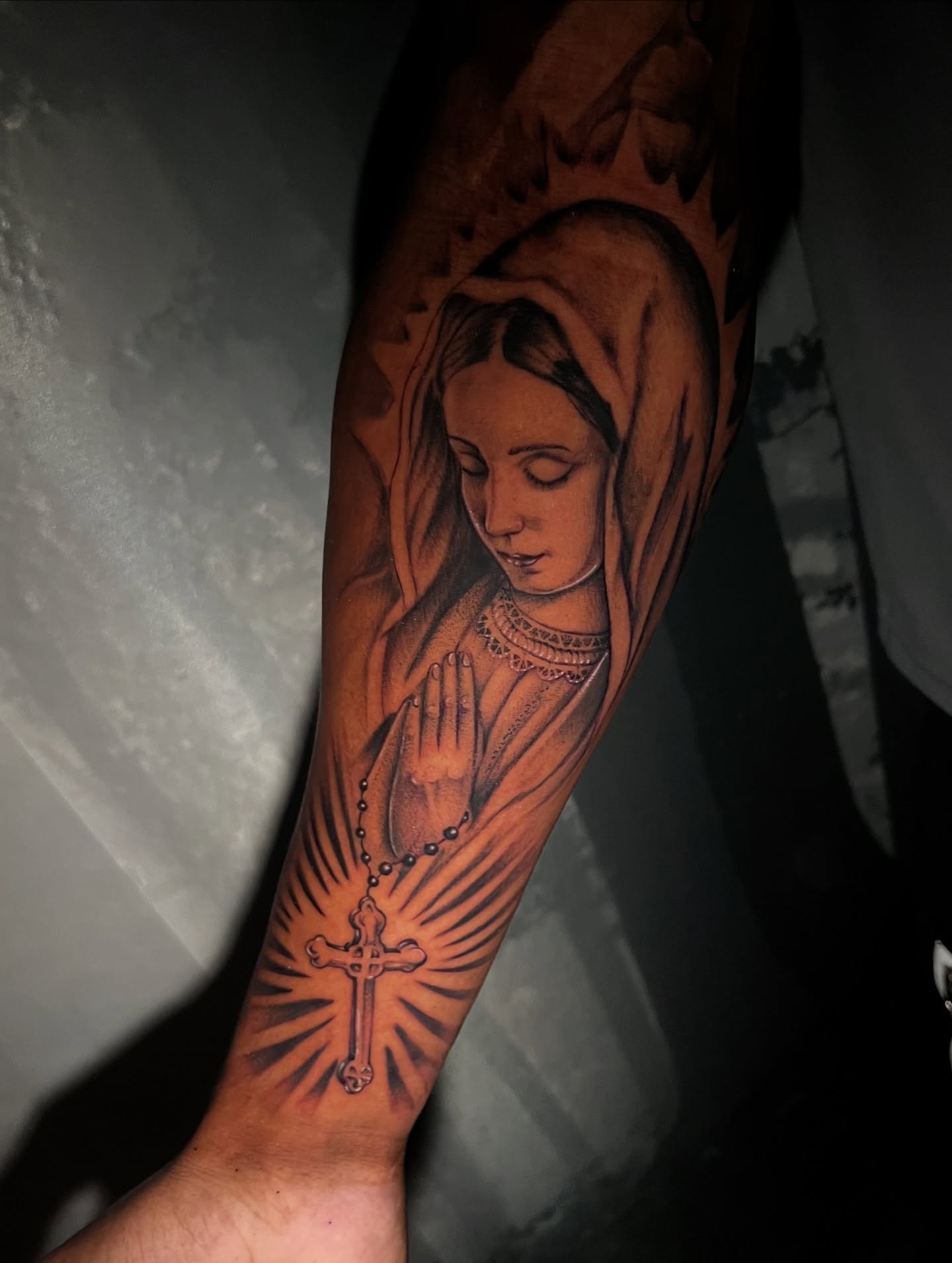 Praying woman realism tattoo on the forearm by Jacob Sass