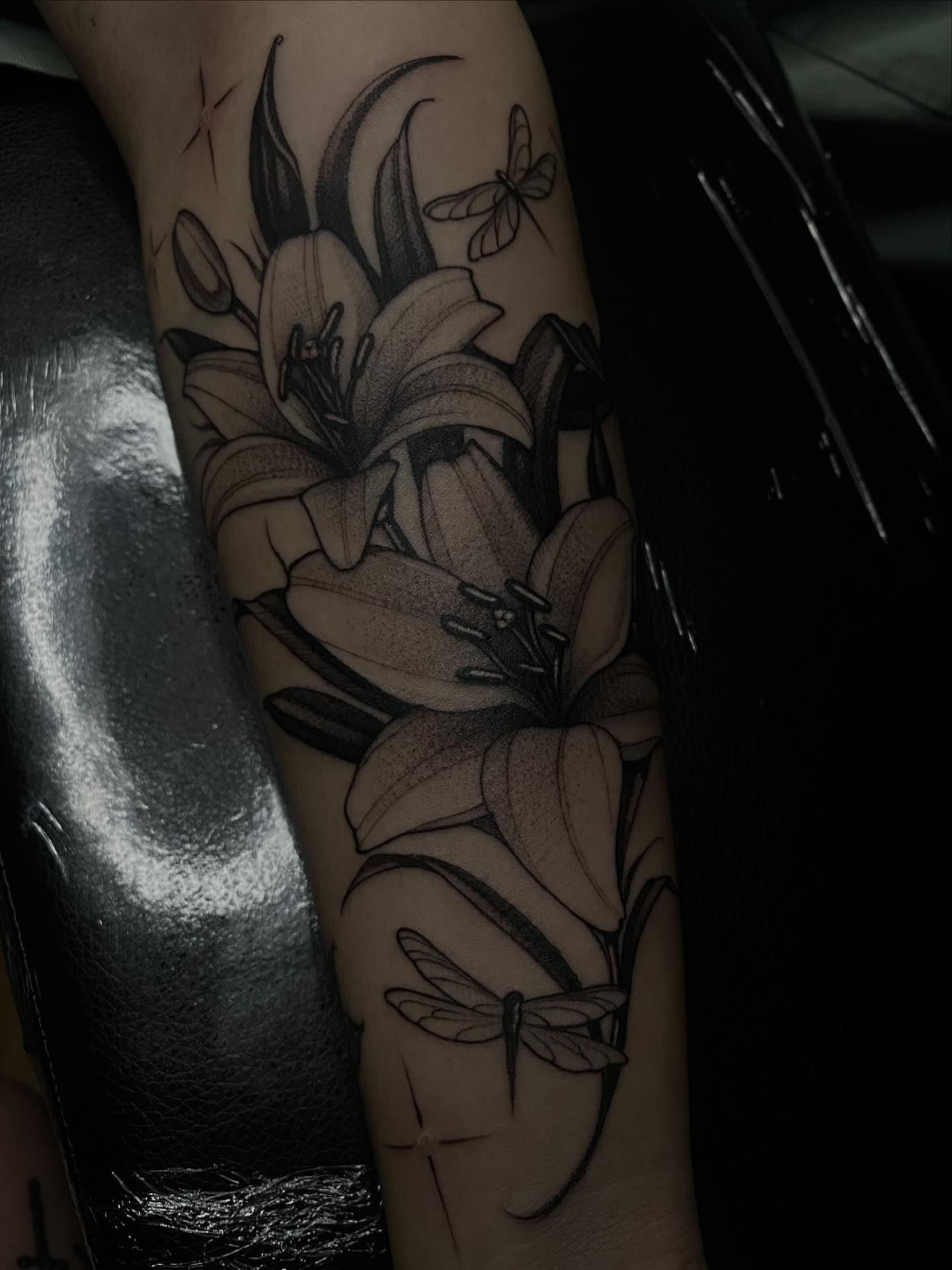 Lilies and dragonflies realism tattoo on the forearm by 𝔗𝔞𝔶𝔩𝔬𝔯 𝔈𝔩𝔦𝔷𝔞𝔟𝔢𝔱𝔥, Tulsa, Oklahoma