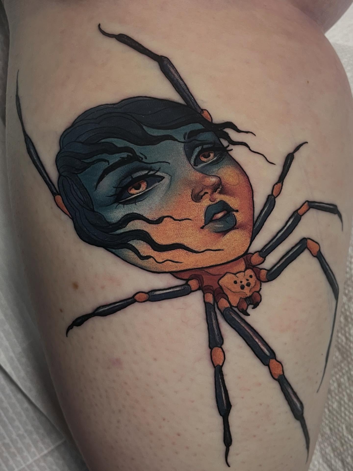 Woman with spider dark realism tattoo on the thigh by Leah Marie, Cincinnati