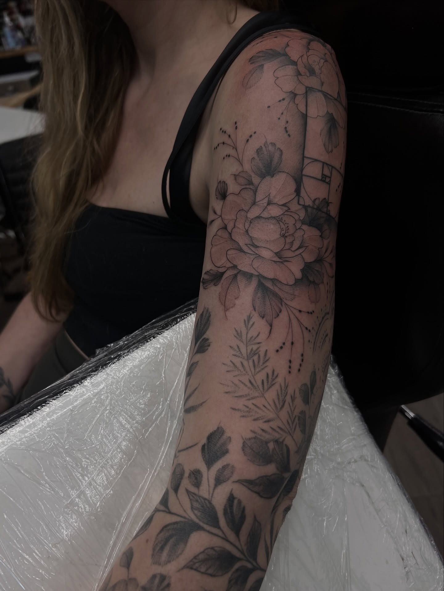 Floral bouquet realism tattoo on the forearm by Chloe